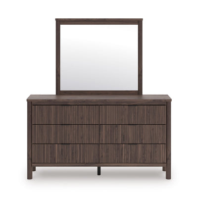 Signature Ashley Pamytta dresser and mirror set in a modern bedroom with wood finish and sleek design.