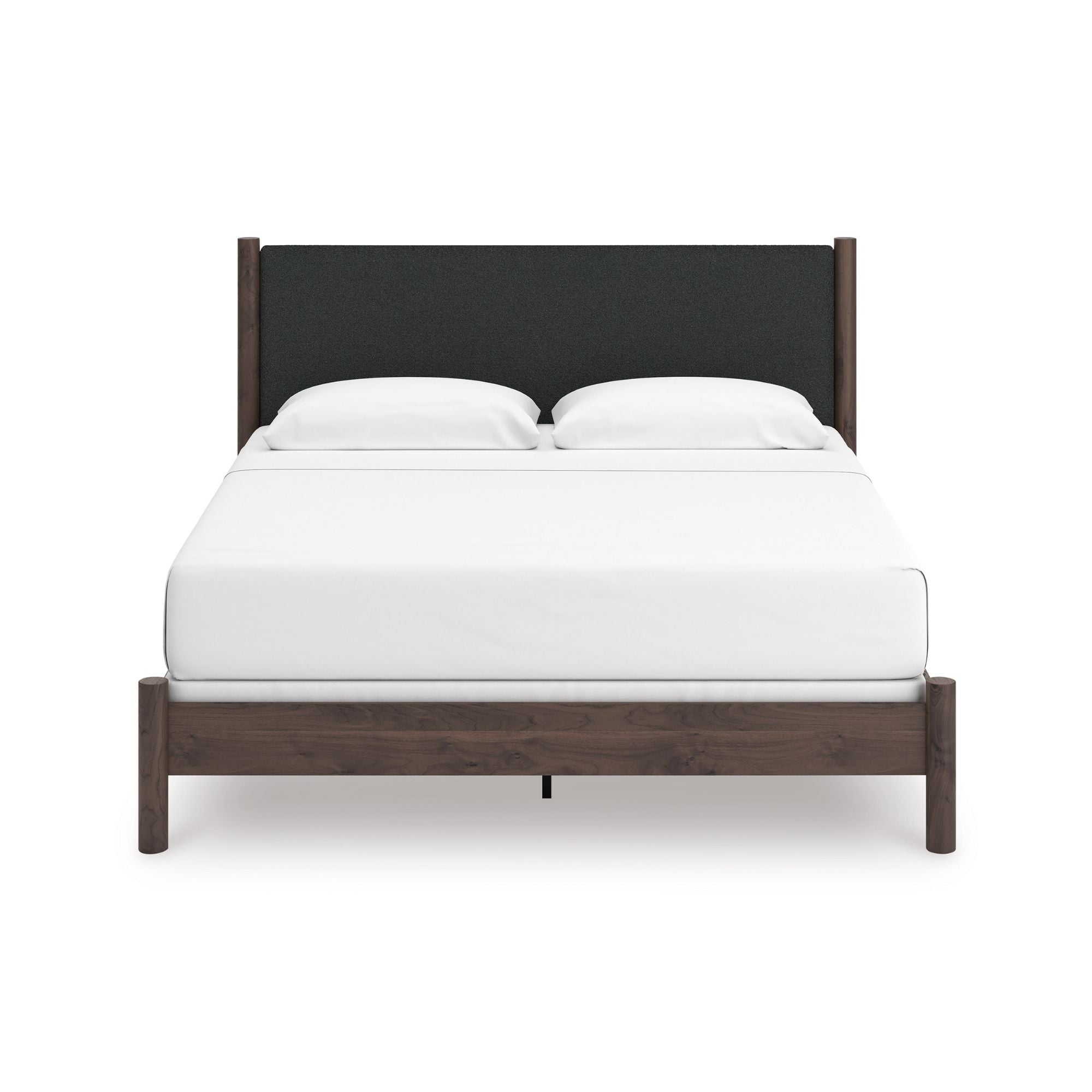 Pamytta upholstered panel platform bed by Signature Ashley with a modern upholstered headboard in a bedroom setting.