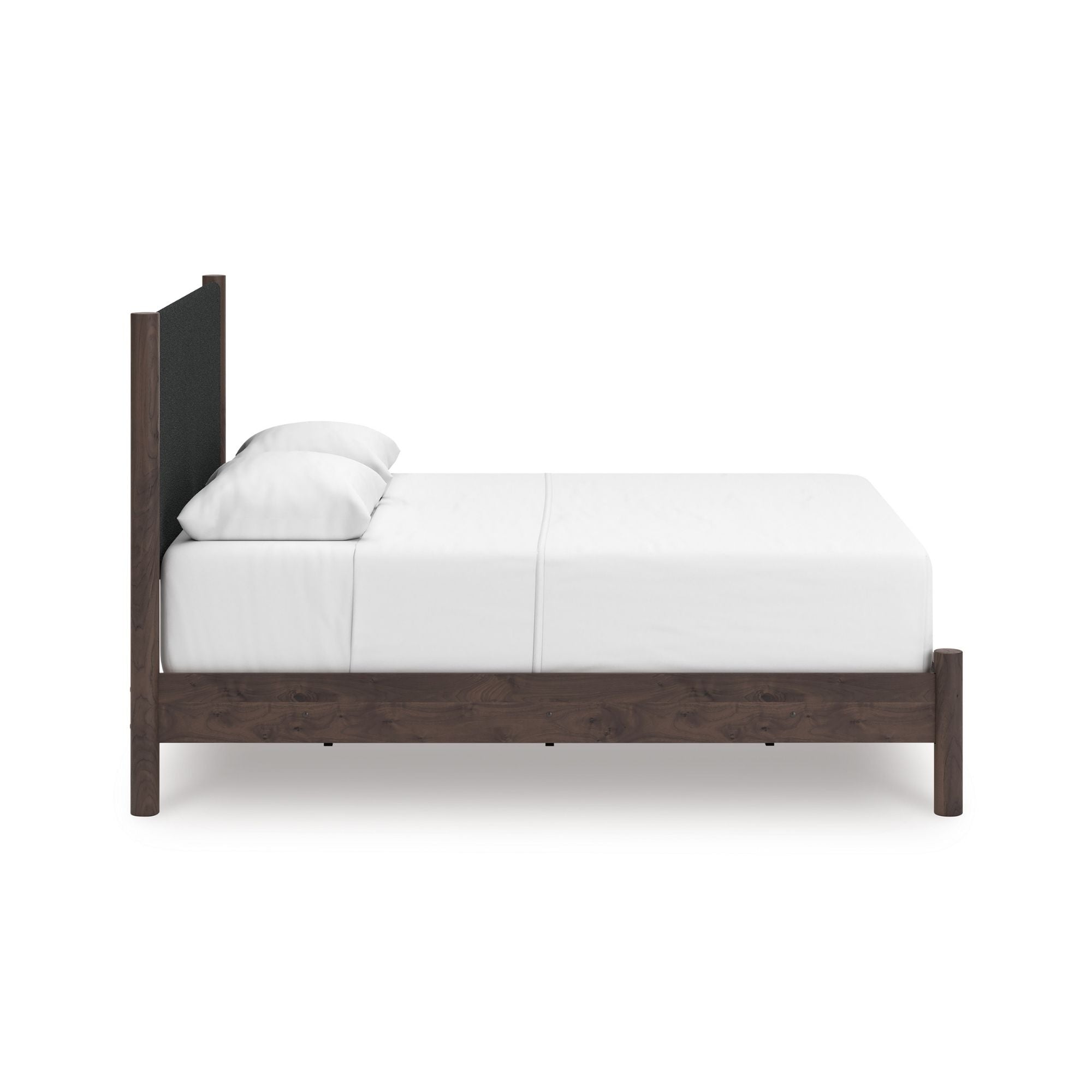 Close-up of the Pamytta upholstered panel platform bedroom set by Signature Ashley, showcasing the upholstered headboard and modern design.