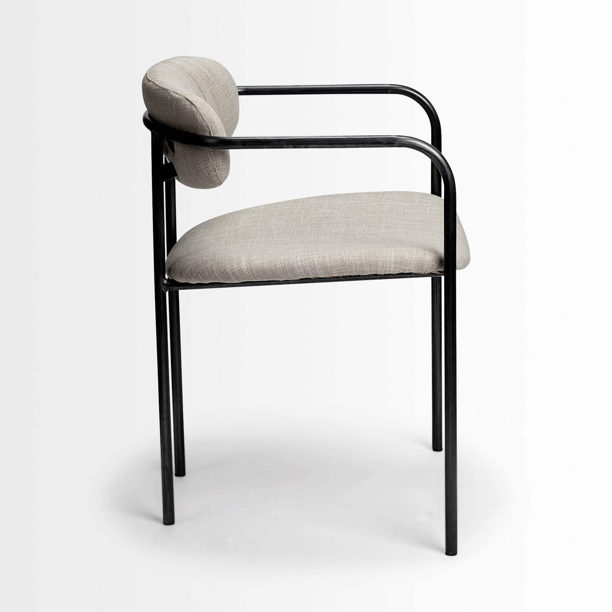 Beige Parker dining chair by Mercana Furniture with wooden legs and upholstered seat, showing a modern, comfortable dining chair design.