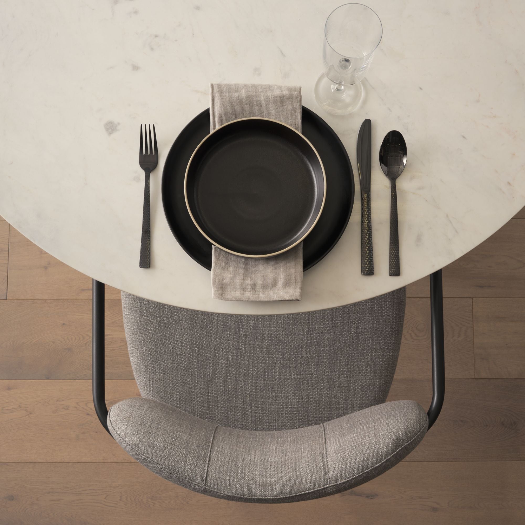 Gray Parker dining chair by Mercana Furniture with sleek modern design and cushioned seat for comfortable dining.
