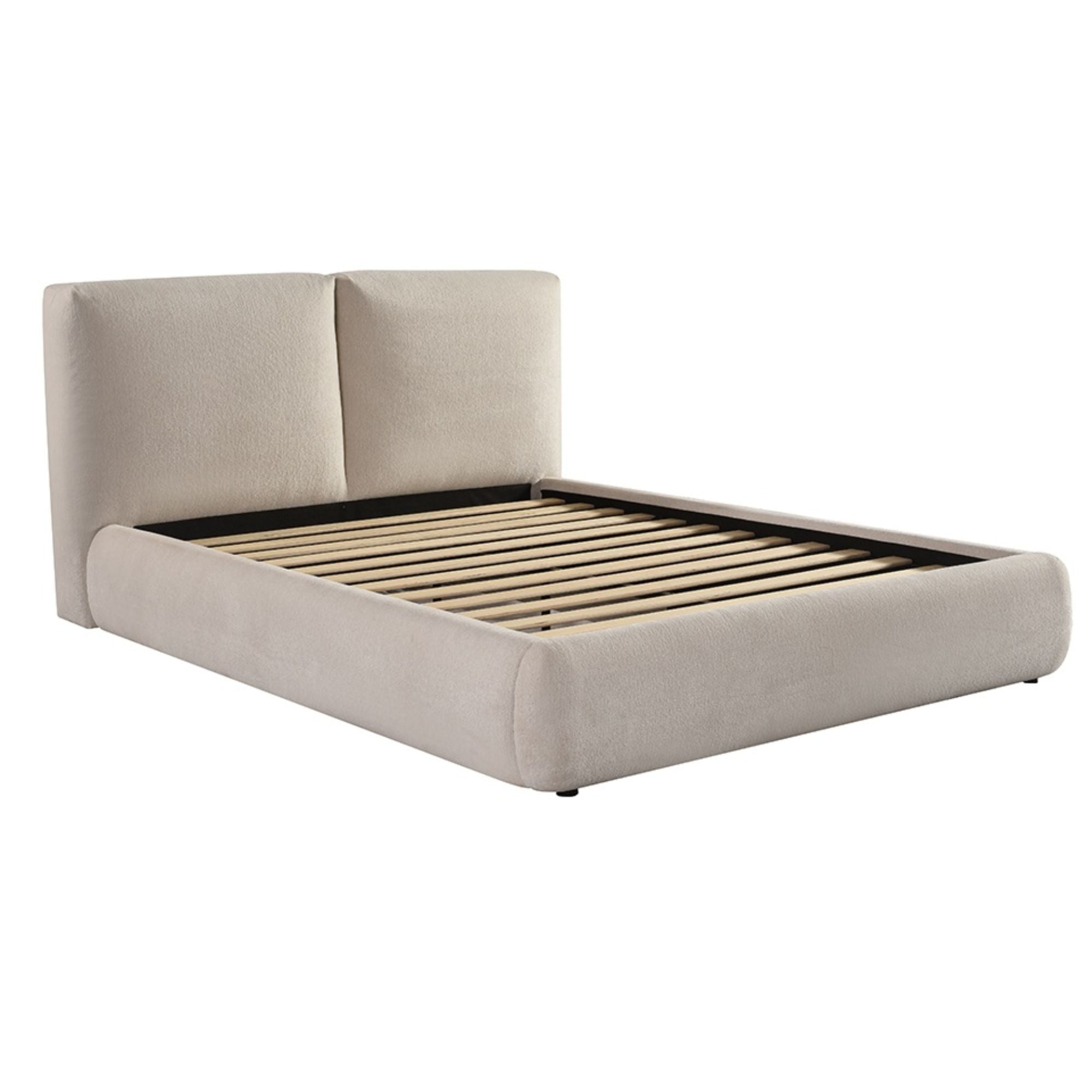 Beige silhouette modern platform bed by Brassex with sleek design and clean lines, shown from a side view in a contemporary bedroom setting.