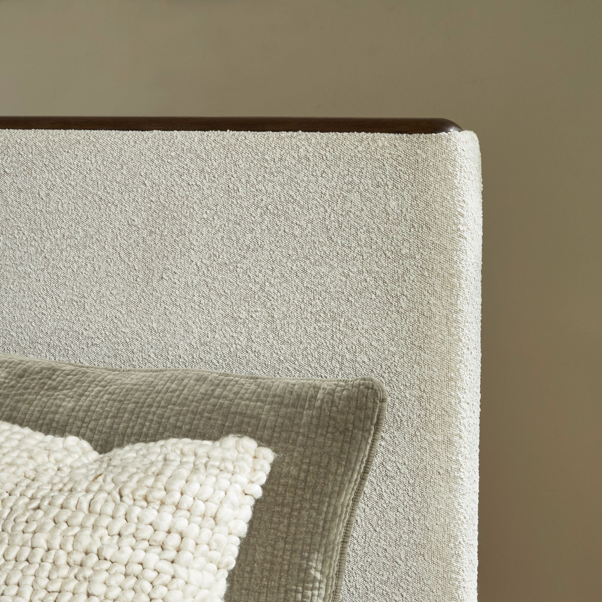 Radkin upholstered panel bed from Signature Design by Ashley in a modern bedroom setting with neutral-toned bedding.