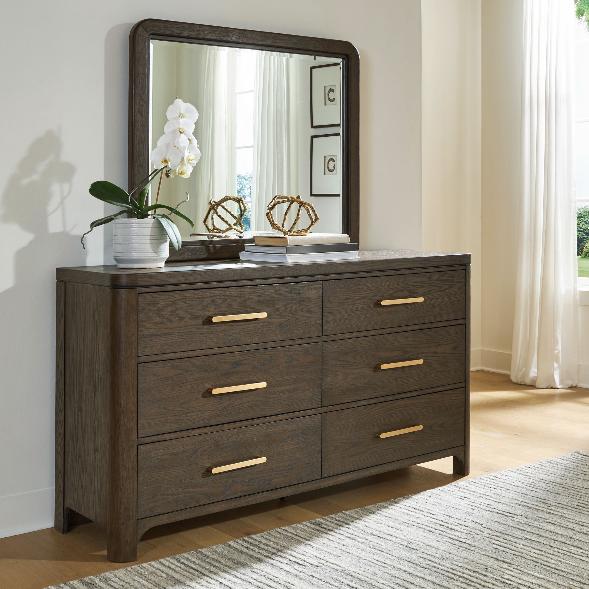 Radkin dresser and mirror from Signature Design by Ashley, showcasing a modern bedroom furniture set with wood finish and sleek design.