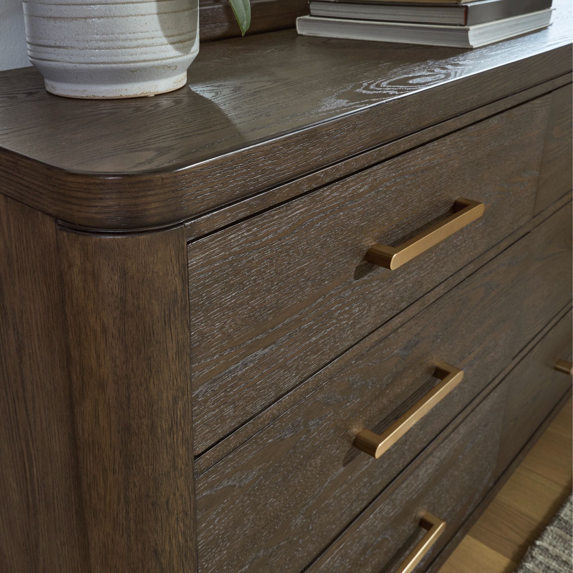 Radkin dresser and mirror from Signature Design by Ashley, featuring a modern wood finish and sleek storage drawers.
