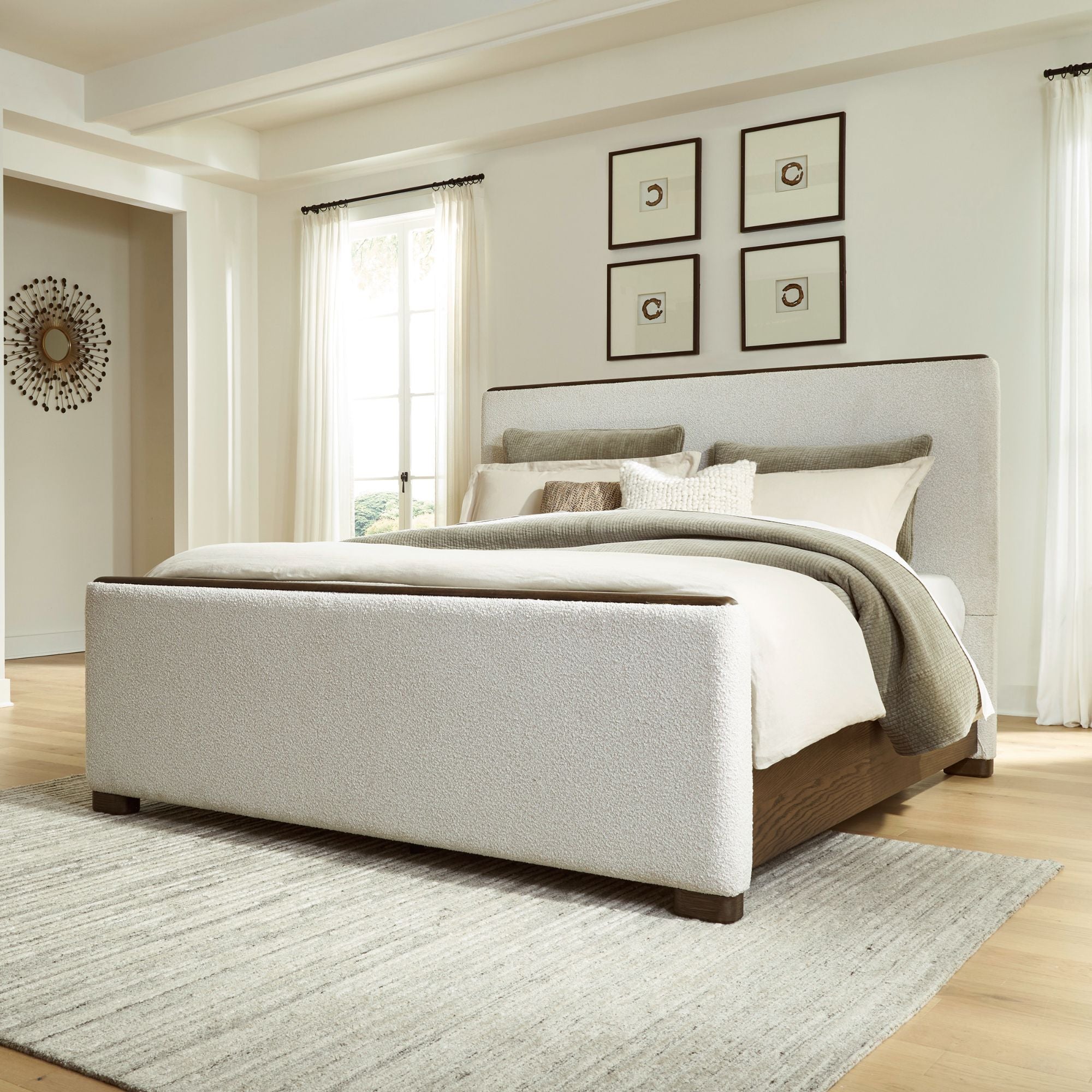 Radkin upholstered panel bed from Signature Design by Ashley in a modern bedroom setting with neutral tones.