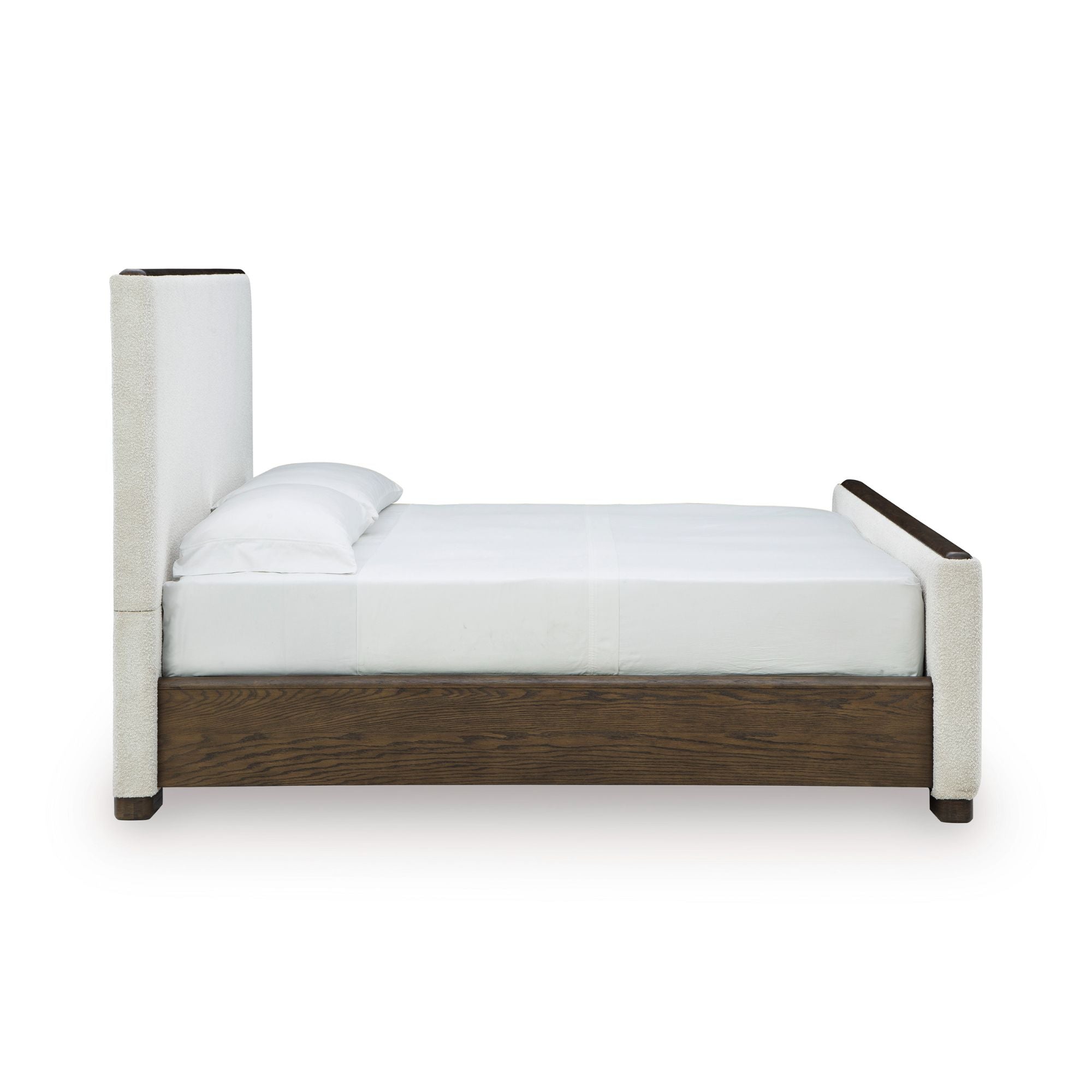 Radkin upholstered panel bed from Signature Design by Ashley with a padded fabric headboard and sleek wooden frame in a bedroom setting.