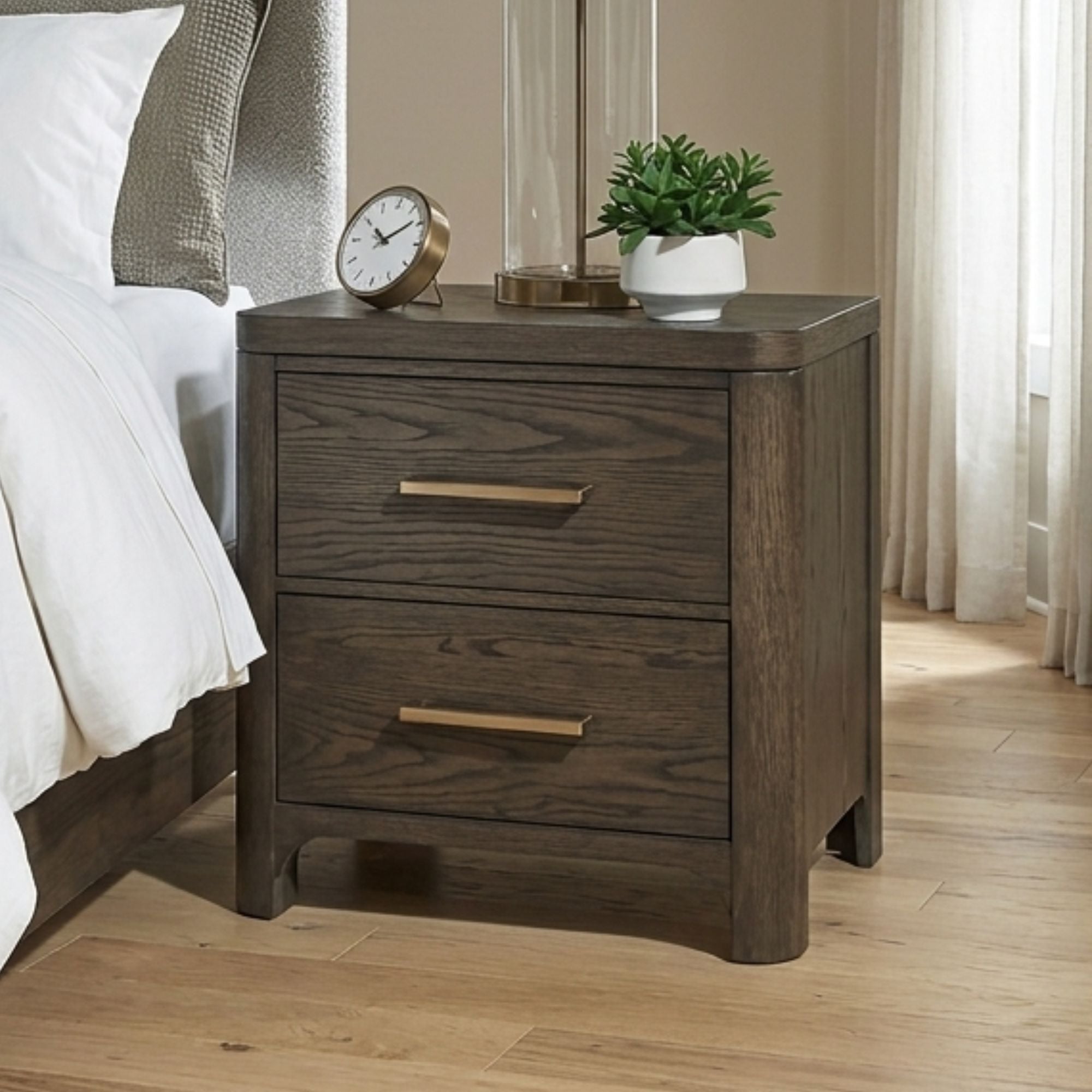 Radkin two-drawer nightstand from Signature Design by Ashley, featuring a modern bedroom furniture piece with sleek wood finish.