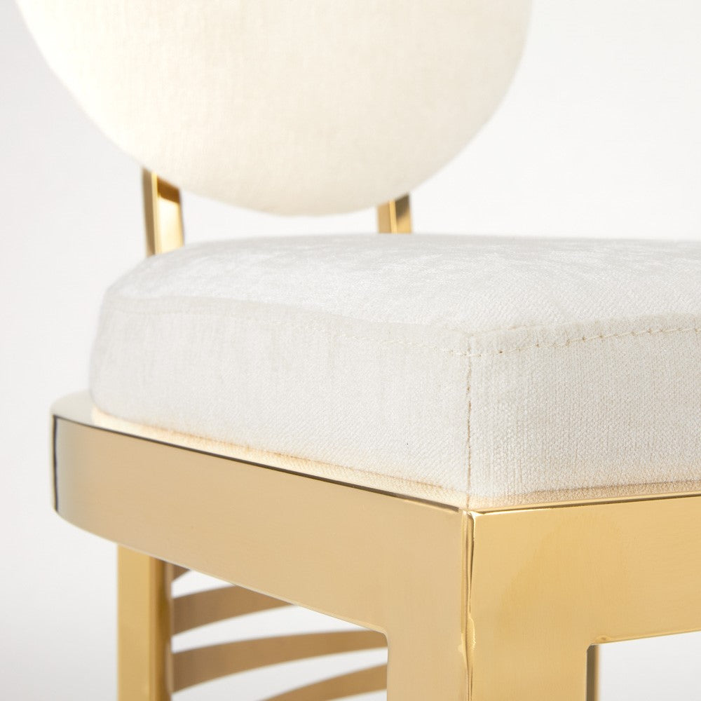 Xcella Rochelle gold counter stool with a sleek, modern design featuring a cushioned seat and sturdy metal frame.