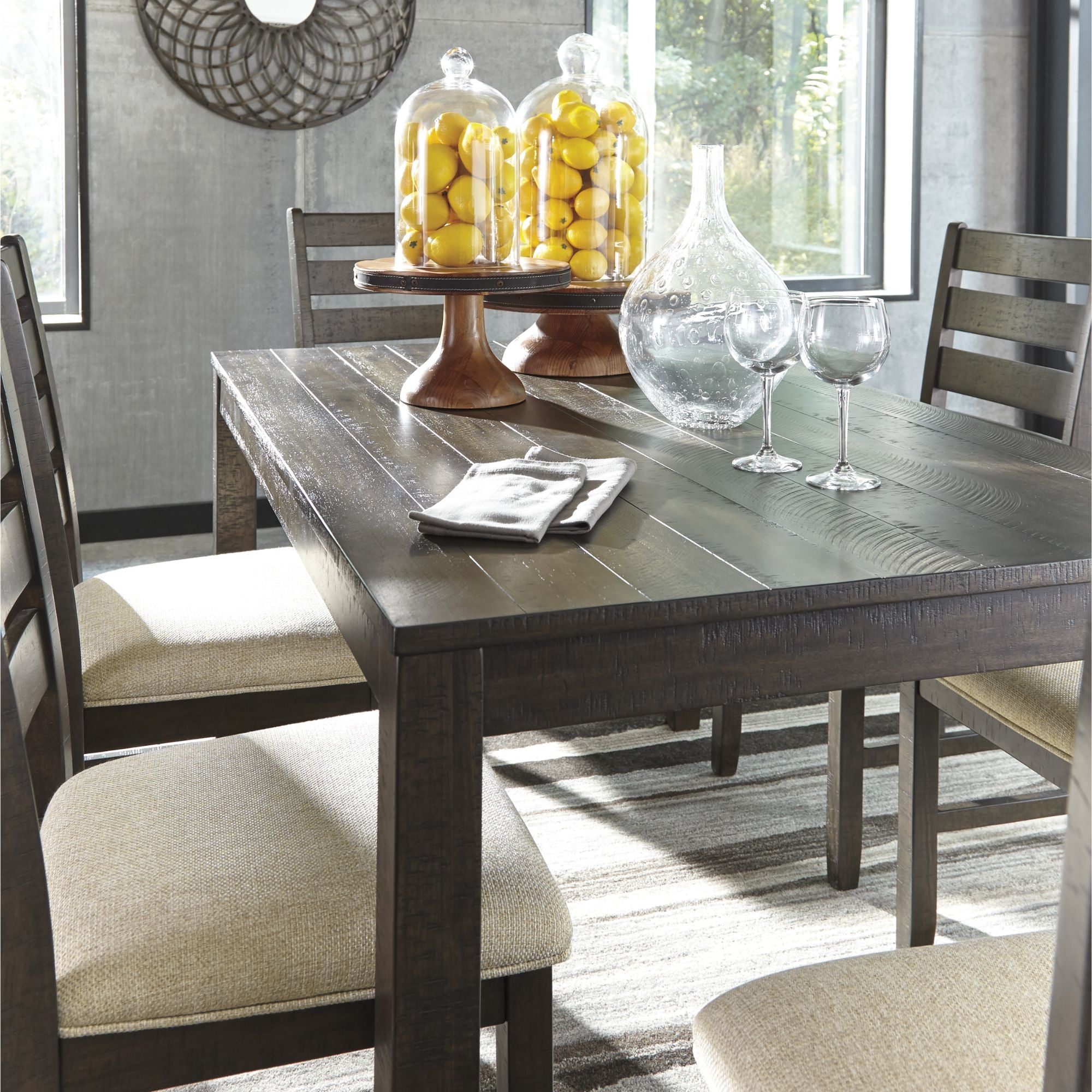 Seven-piece Rokane dining room table set by Signature Ashley, includes a table and matching chairs in a modern wood finish.