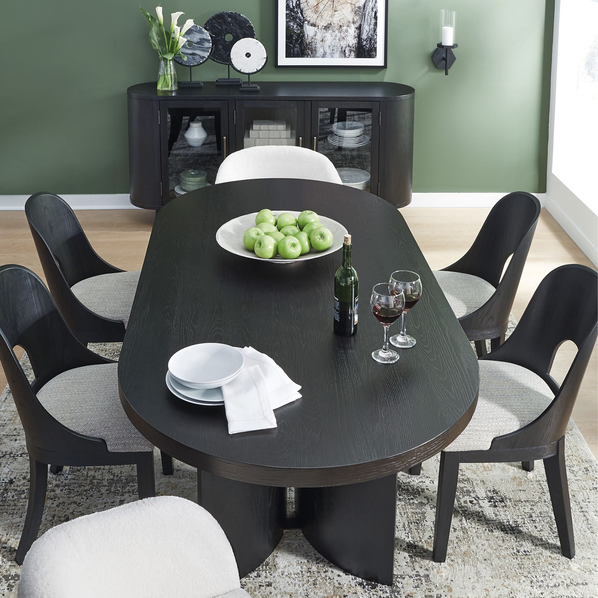 Ashley Rowanbeck 7-piece dining room set with side and arm chairs, featuring a modern wood finish and comfortable upholstered seats.