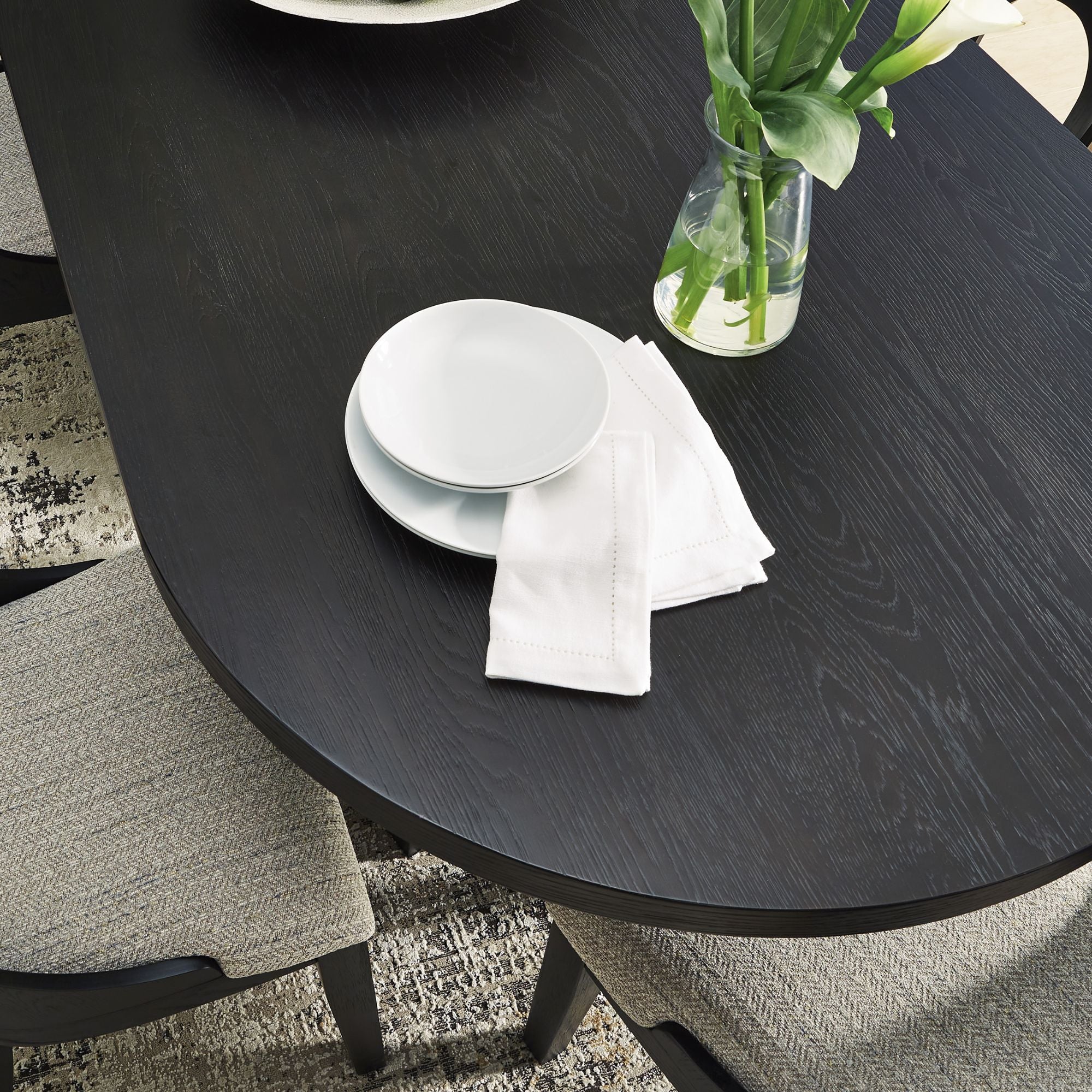 Oval wooden dining table by Signature Ashley with a polished finish and sturdy legs, ideal for family meals and gatherings.