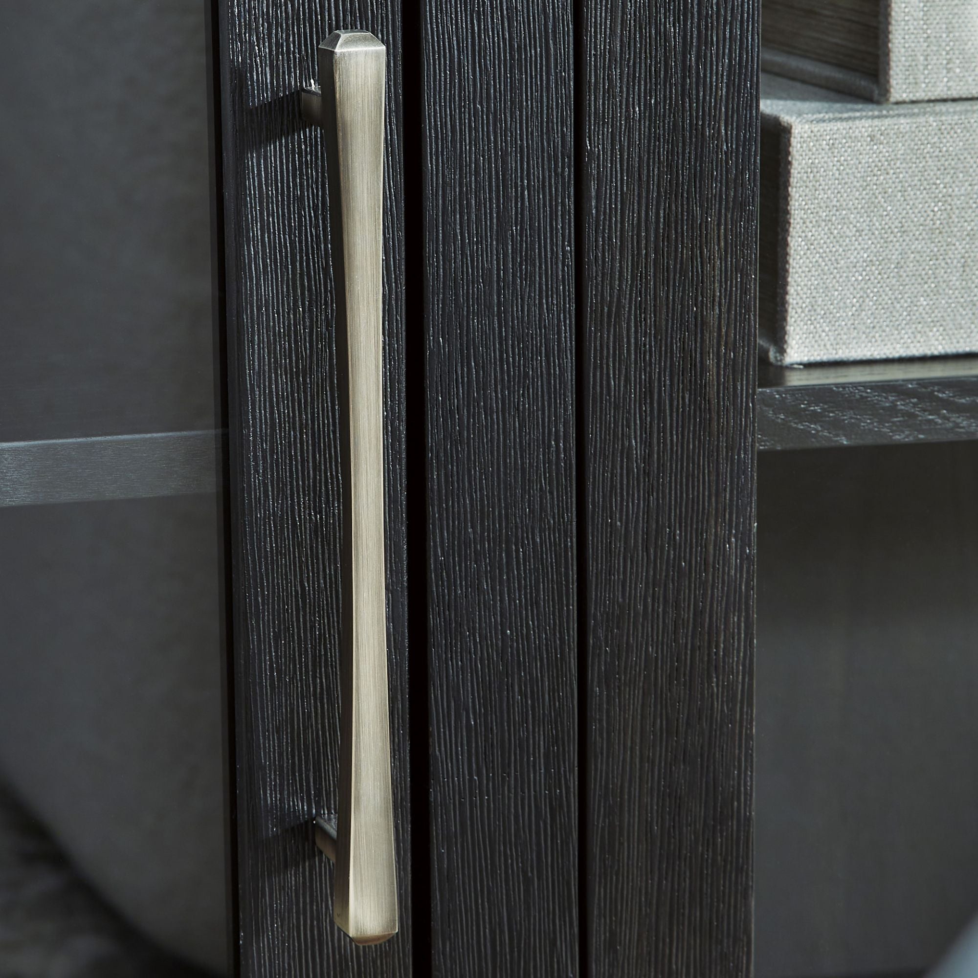 Signature Ashley Rowanbeck dining room server with a dark wood finish, featuring multiple drawers and cabinet storage for dining essentials.