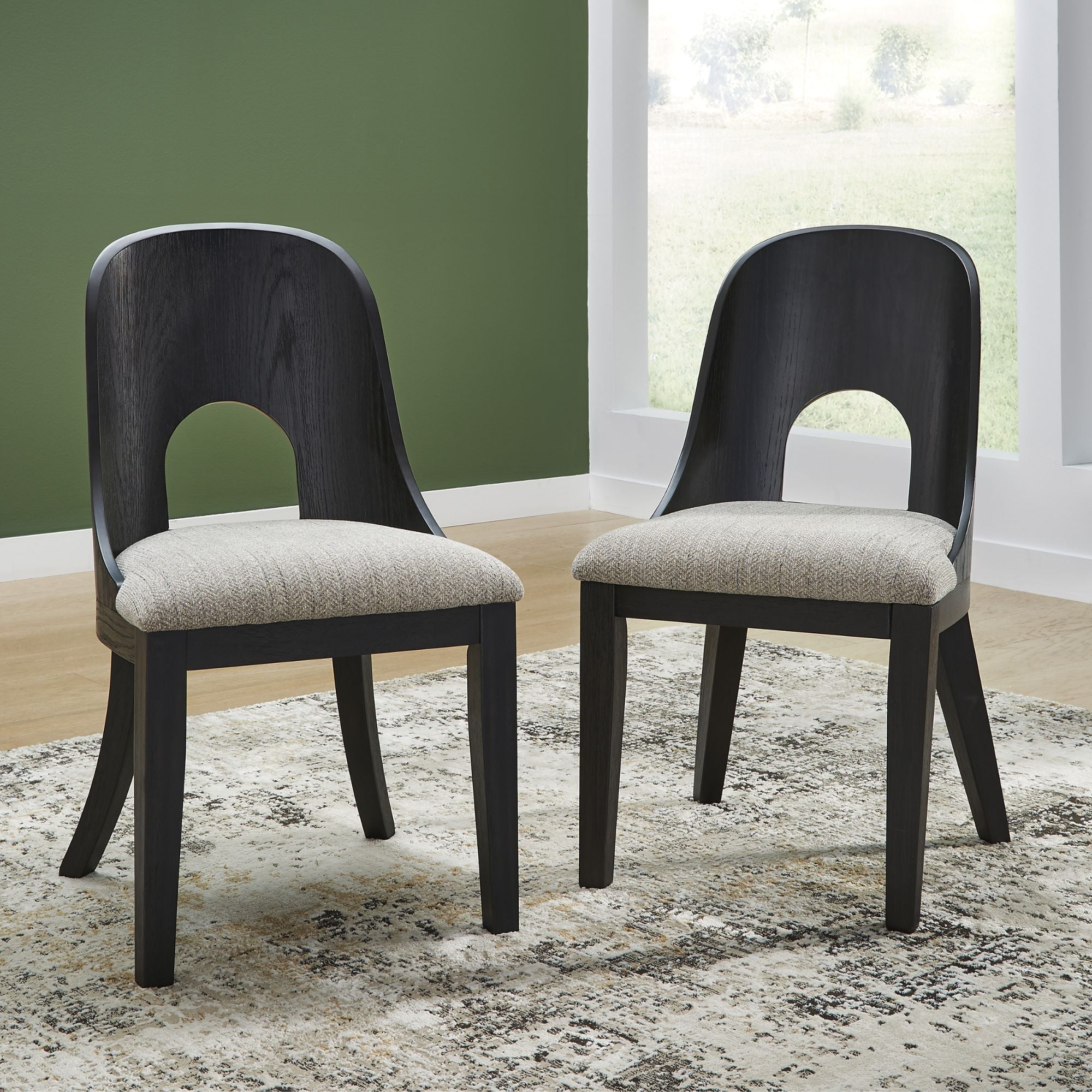 Signature Ashley Rowanbeck dining UPH side chair with upholstered seat and wooden legs, showcasing its stylish design and comfort.