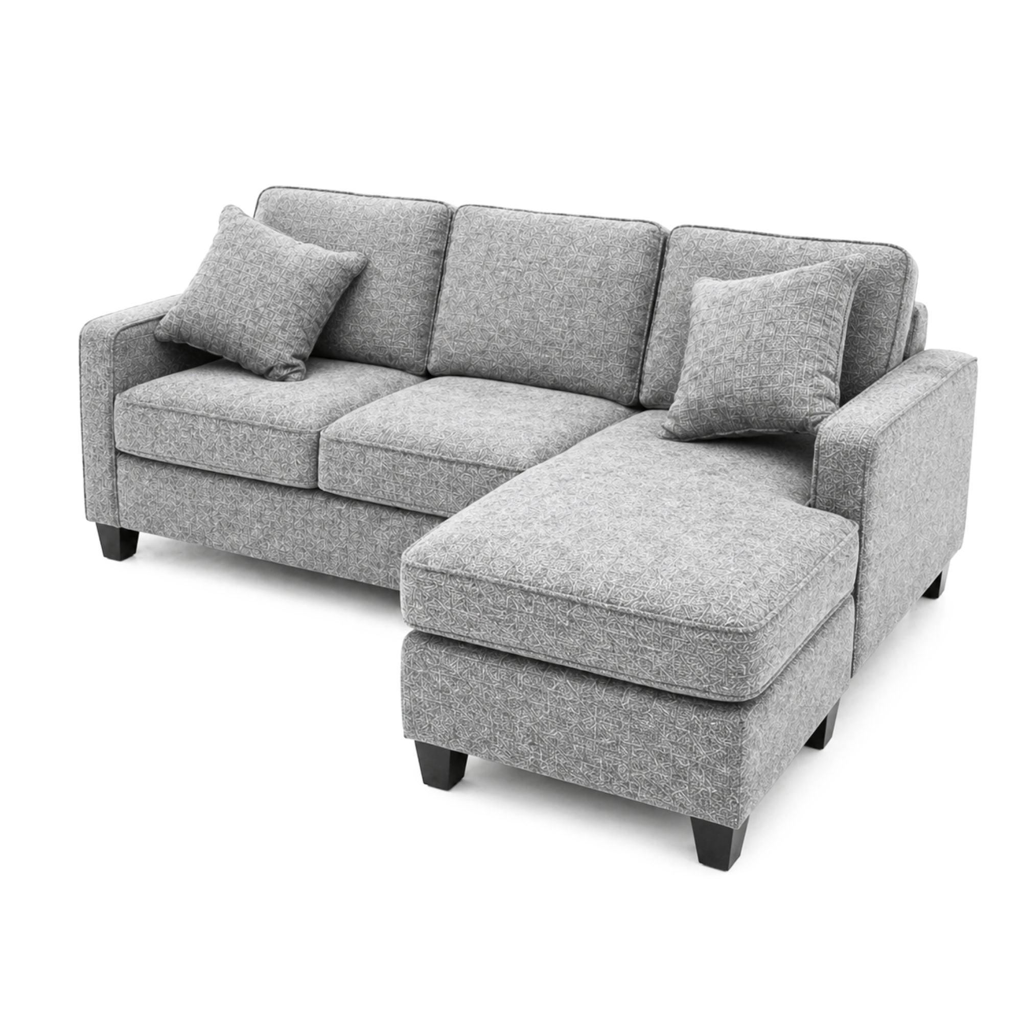 Canadian made A.C. reversible sectional sofa with chaise ottoman in snow grey fabric, featuring modern design and plush cushions.