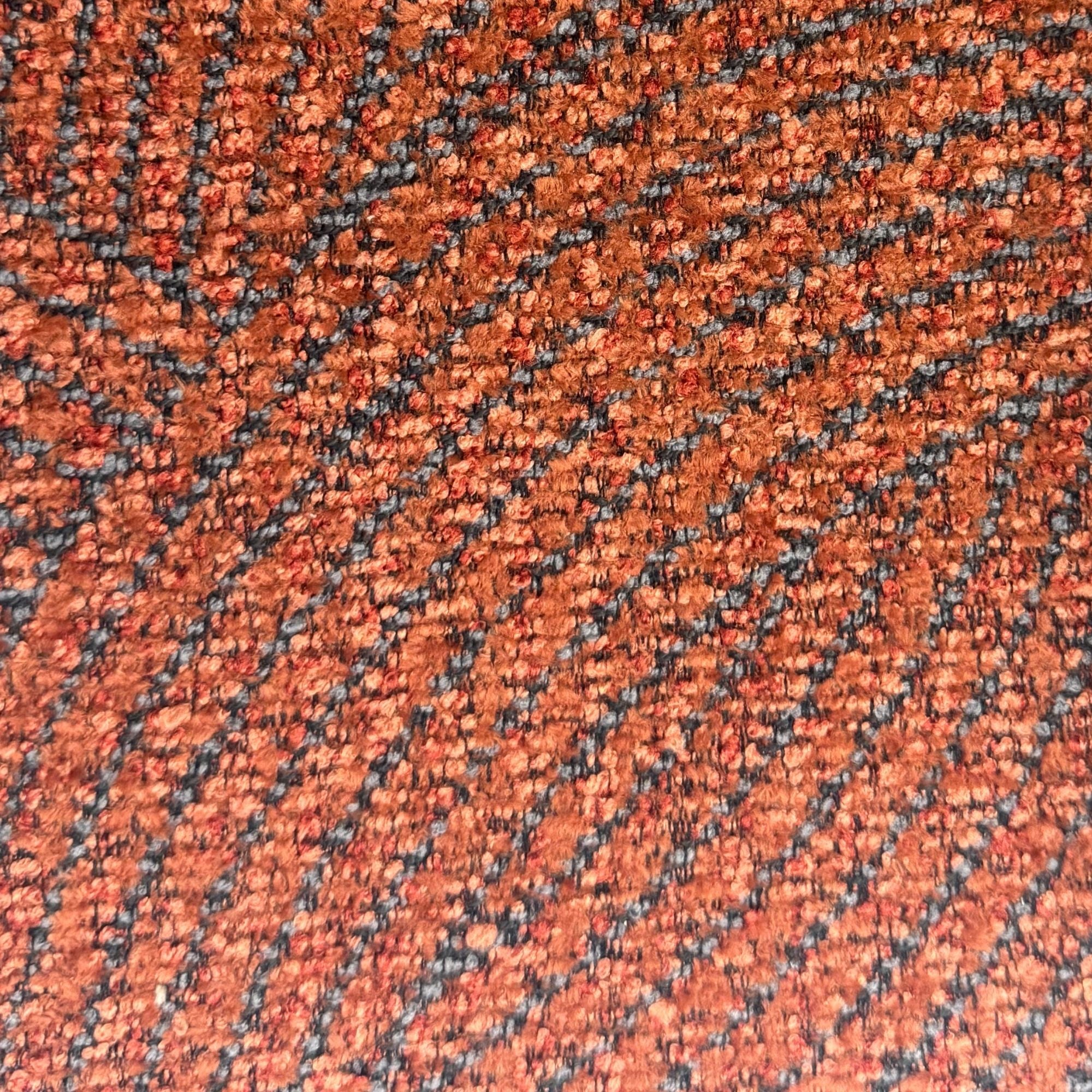 A.C. Canadian made reversible sectional sofa with chaise and ottoman in vibrant orange fabric, showing the seating and chaise layout.