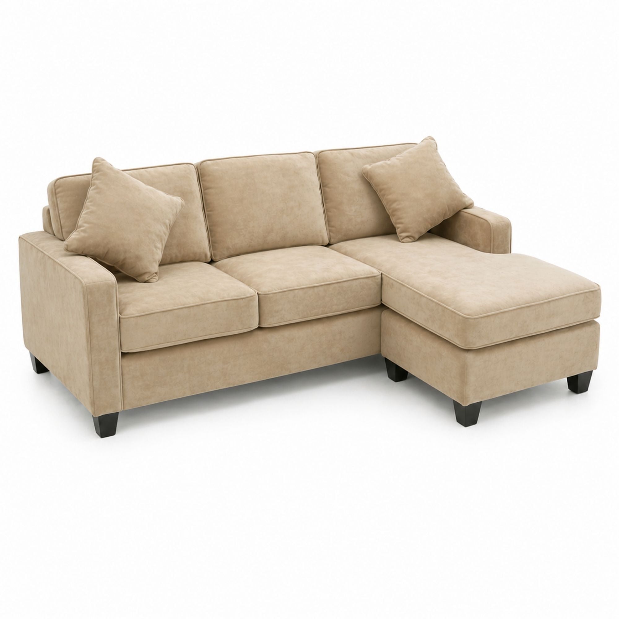 A beige Canadian-made reversible sectional sofa with chaise and matching ottoman, featuring plush cushions and modern design.