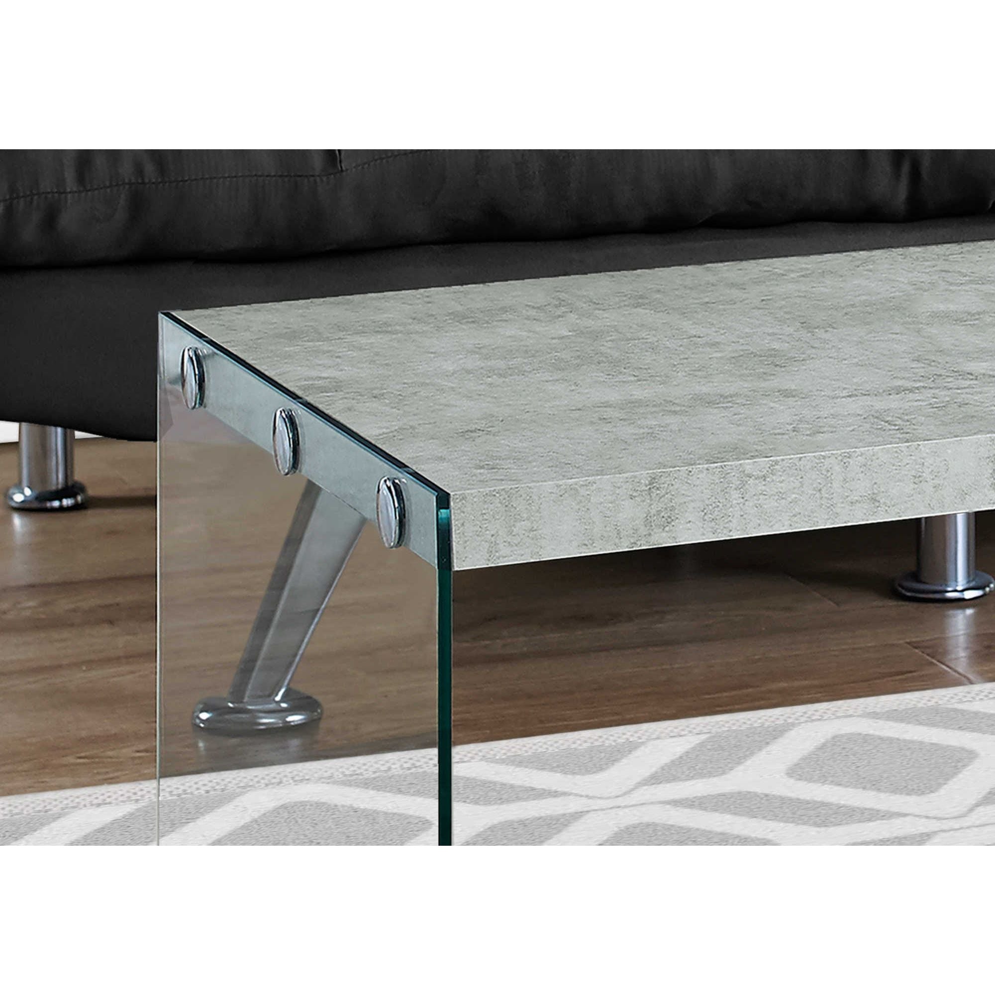 Silver coffee table in grey cement finish by Monarch Specialties, showcasing a modern, rectangular design with sleek legs.