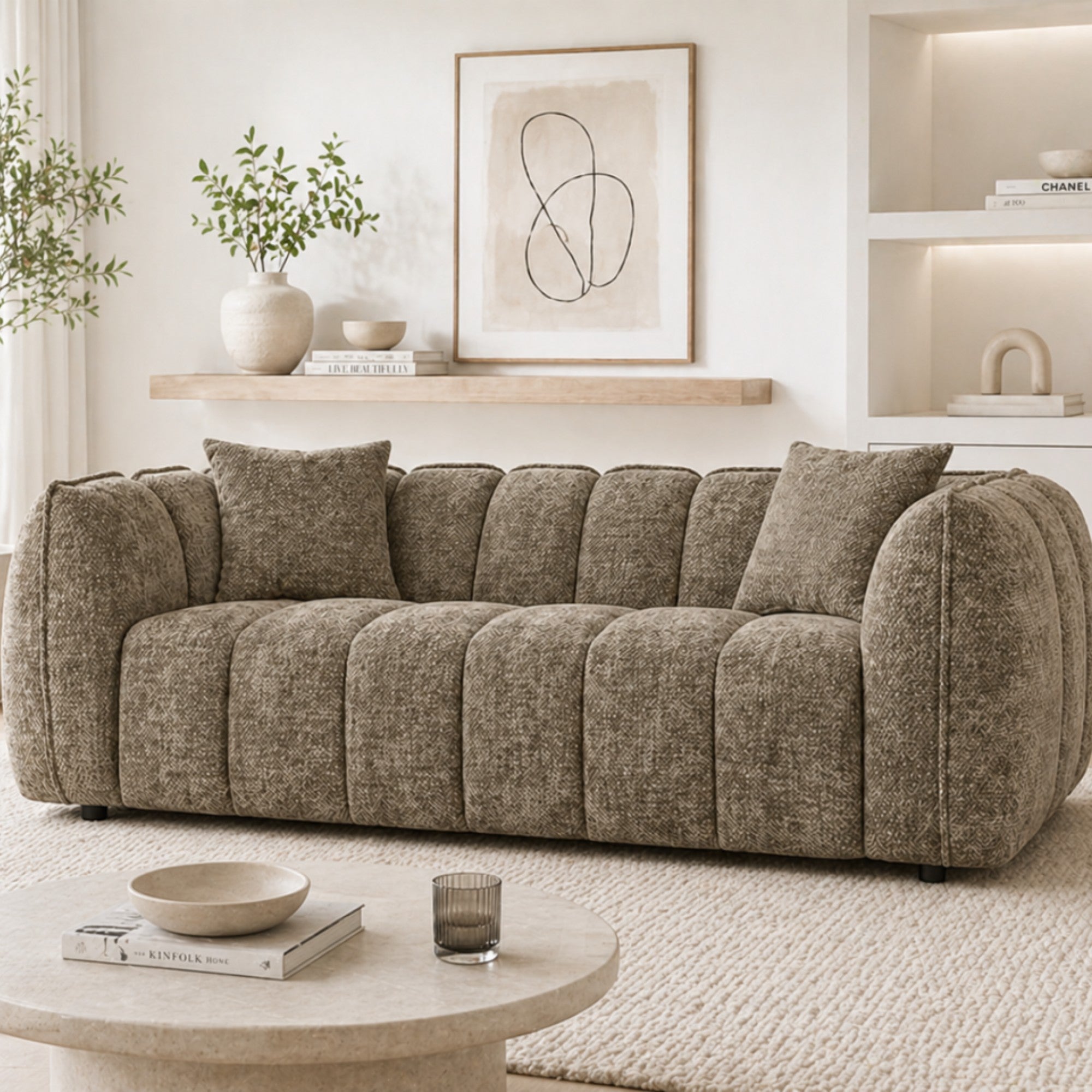 Brown contemporary channel-tufted sofa by Brassex, showcasing plush cushioning and modern design in a stylish living room setting.