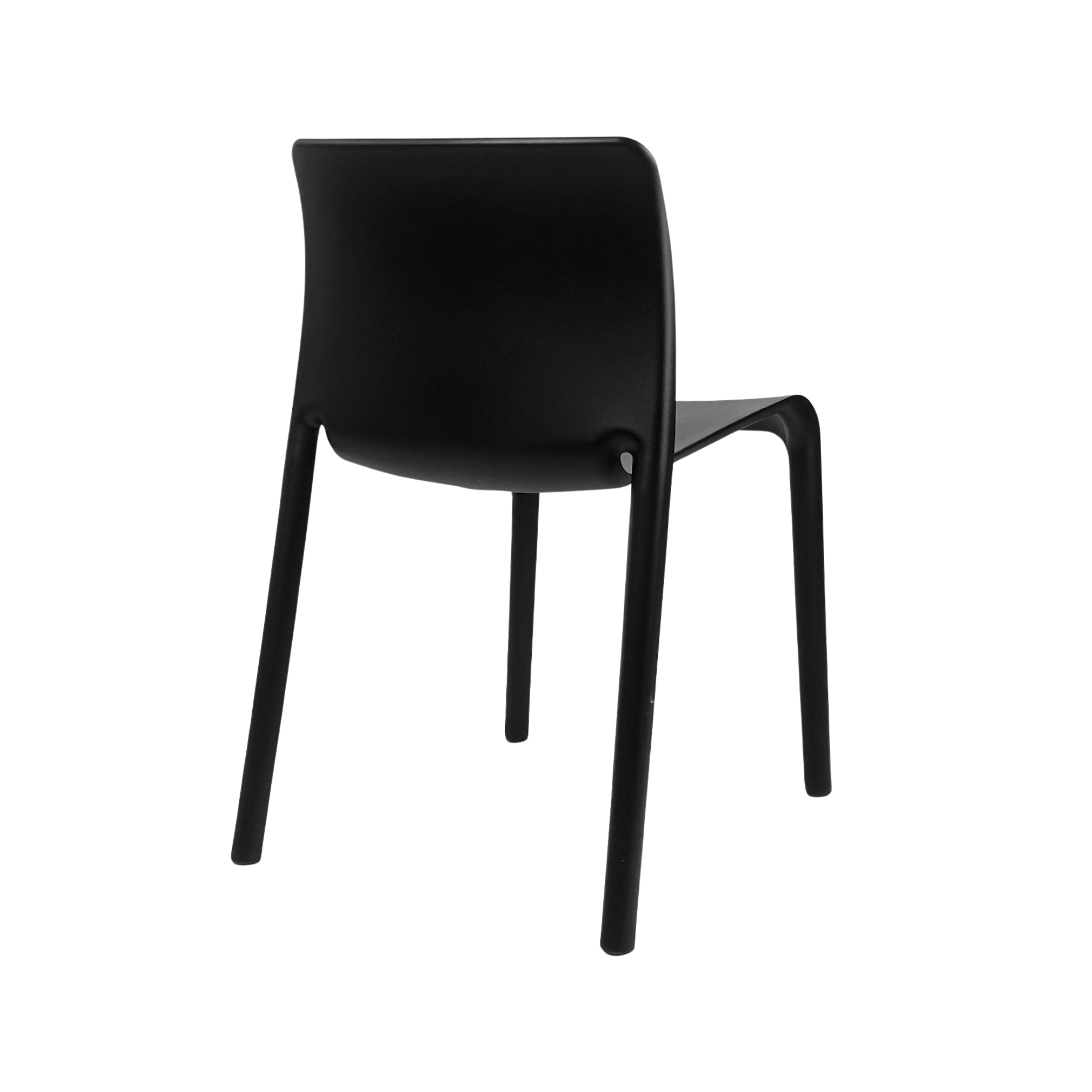 Set of four black Elite Living Faro stackable dining chairs stacked together, showcasing modern design and sleek black finish.