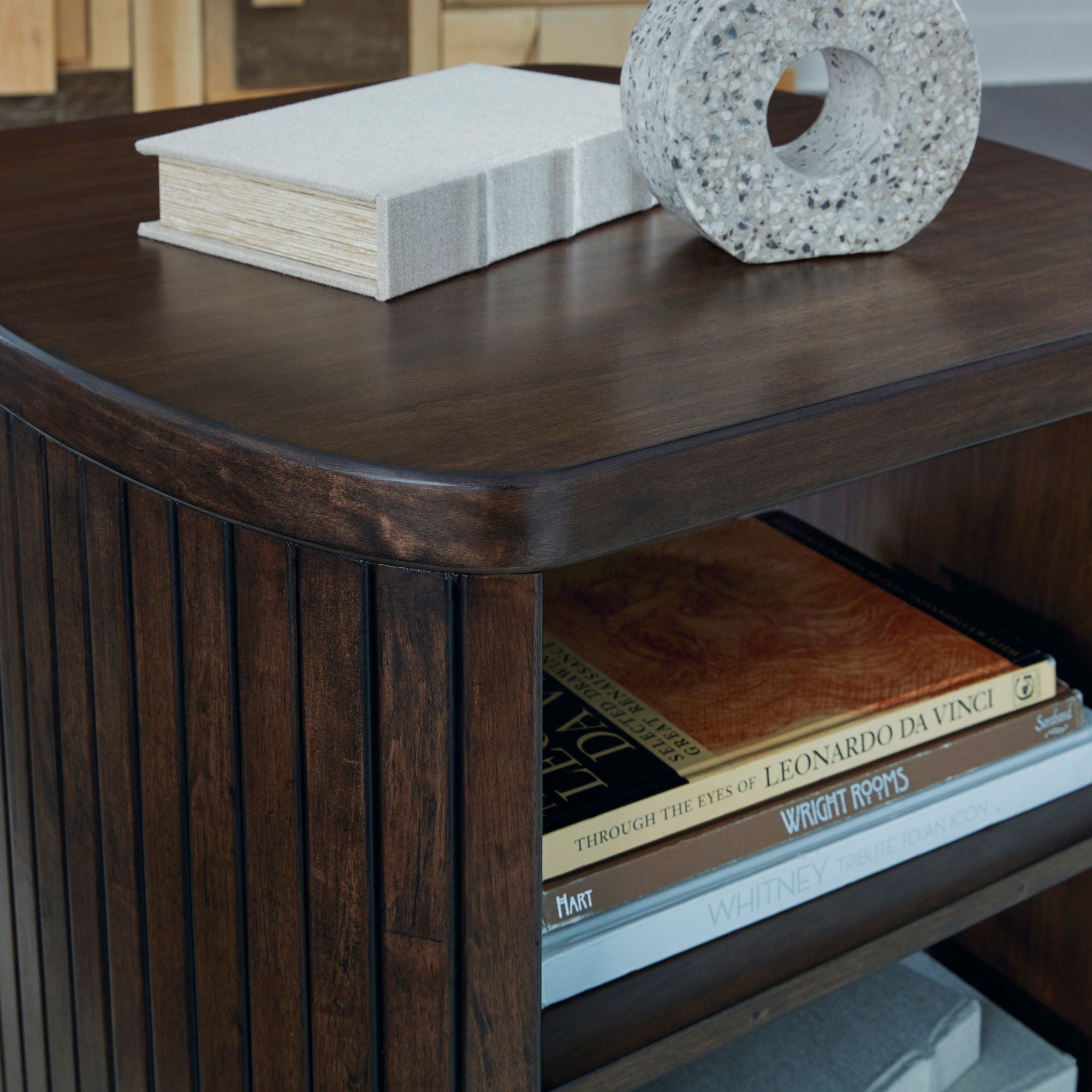Square end table from Signature Design by Ashley with a sleek, modern design and wood finish, perfect for living room decor.