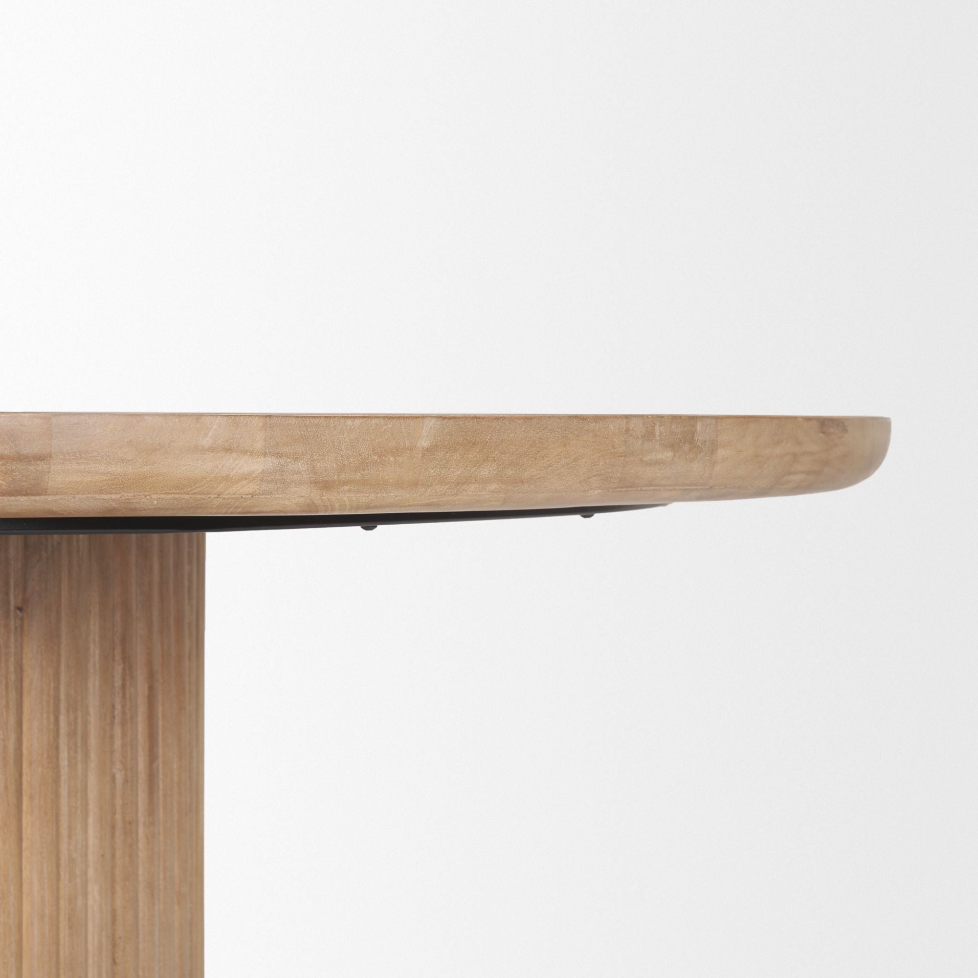 Light brown wood round dining table from Mercana Terra Collection, 60-inch size, with a smooth surface and sturdy legs.