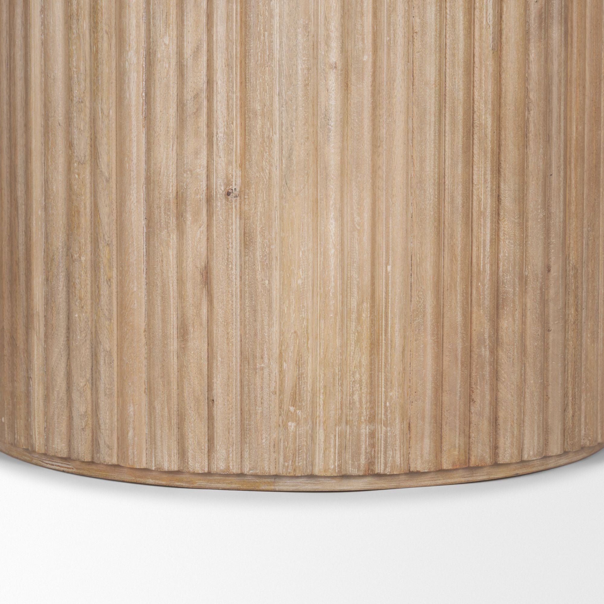 Light brown wood round dining table from Mercana Terra Collection featuring a smooth surface and sturdy legs.