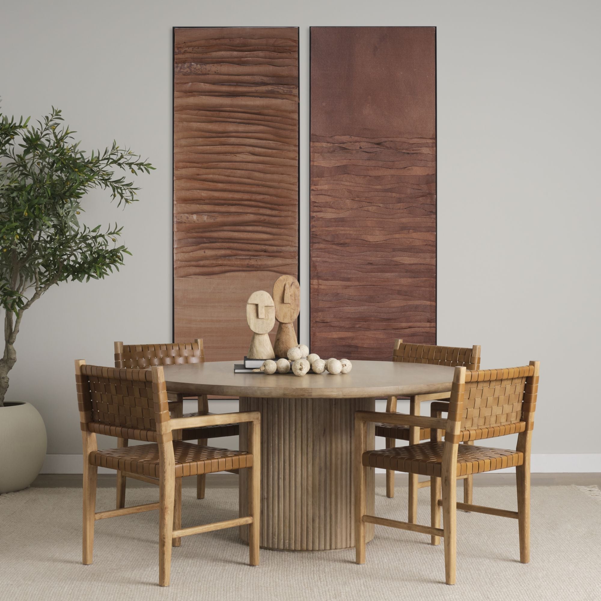 Light brown wood round dining table from Mercana Terra Collection, showcasing a smooth surface and sturdy legs.