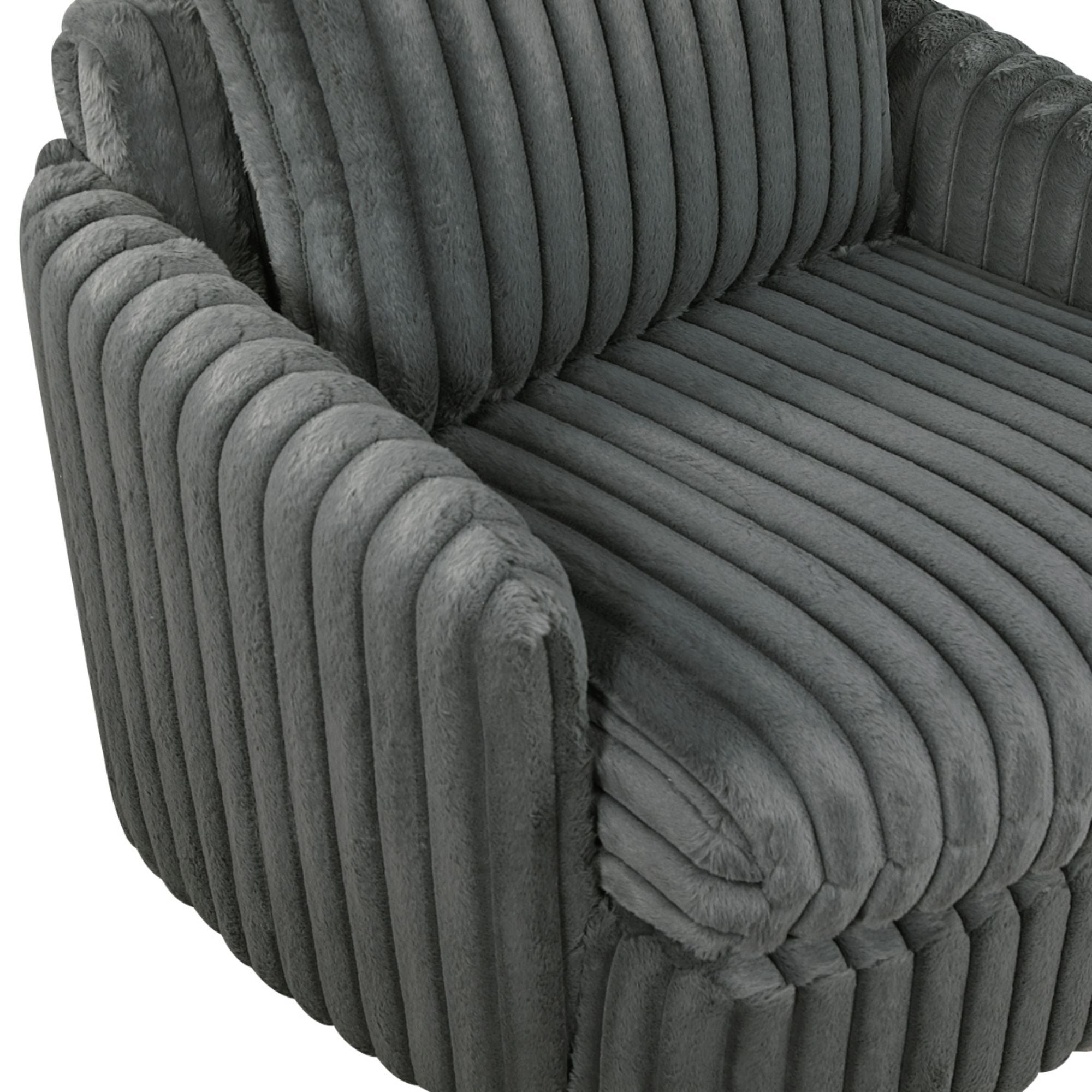 Dark grey Tomball accent chair by M.A.F with plush fabric and modern design, shown in a cozy living room setting.