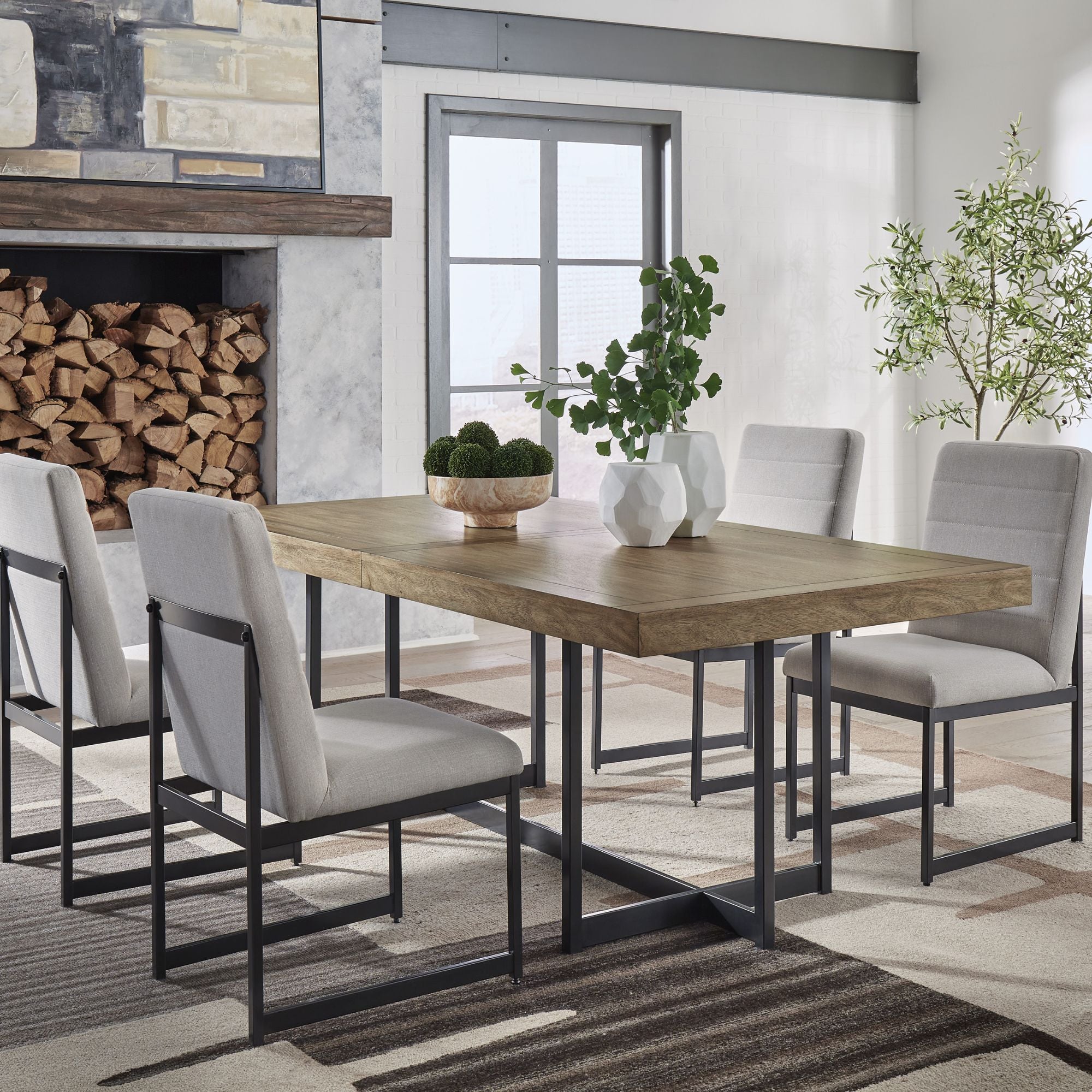 Signature Ashley Tomtyn grey dining room set with a table and chairs, showcasing modern furniture design for dining spaces.