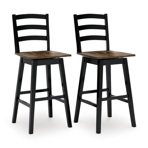 Two Wildenauer swivel barstools from Signature Ashley with dark wood finish and cushioned seats, shown in a dining room setting.