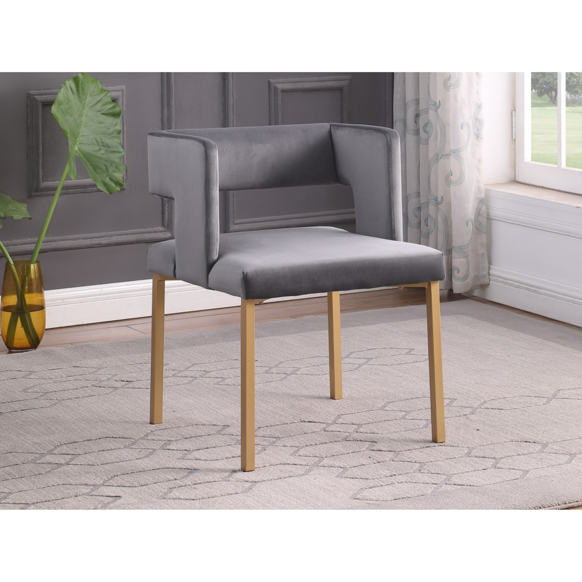 Set of two Brassex Anthony dining chairs in grey velvet with sleek modern design and comfortable padded seats.