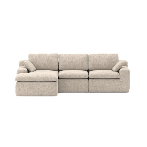 Beige Brassex sectional sofa with compression fabric, showcasing its spacious L-shape design and plush cushions in a living room setting.