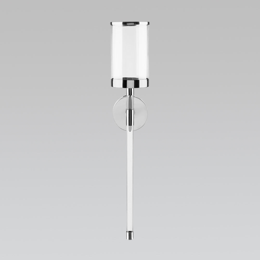 Gold acrylic wall sconce by Xcella, modern decorative light fixture mounted on a wall.