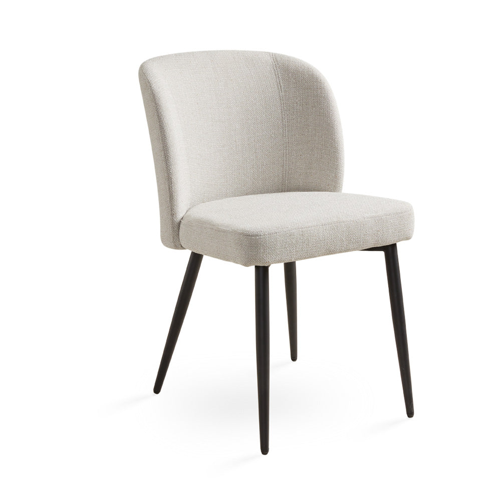 Divya beige linen dining chair with black legs by Ella + Ross, showing a three-quarter view of the stylish kitchen or dining room chair.