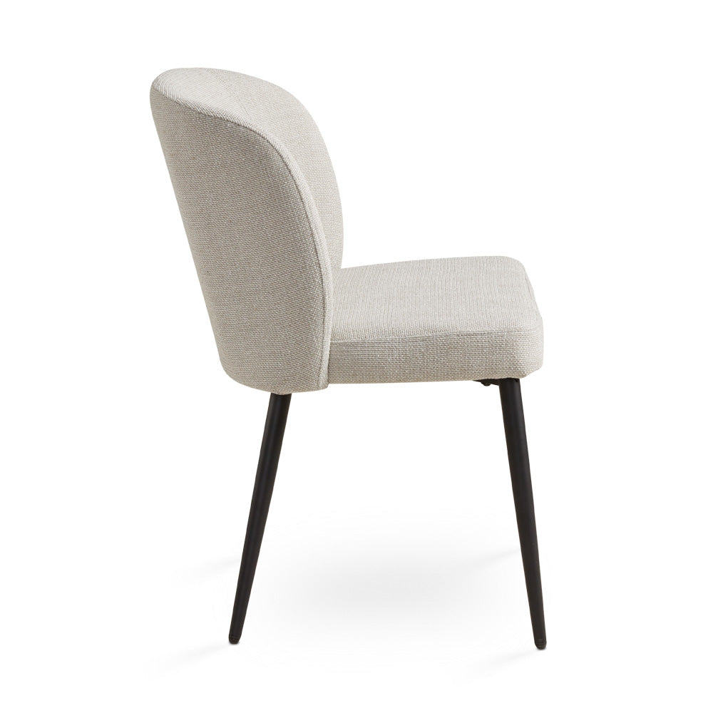 Side view of the Ella + Ross Divya dining chair with Silex beige linen upholstery and black wooden legs.