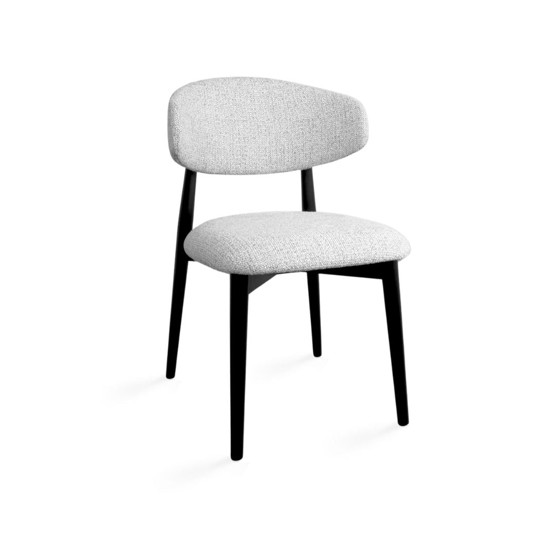 Albin dining chair by Ella + Ross with wooden legs and cushioned upholstered seat in a modern kitchen and dining room setting