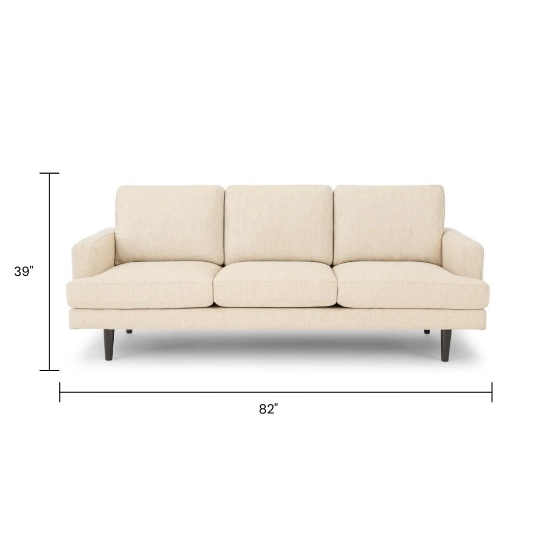 Xcella Wilma Sofa in beige fabric with plush cushions and sleek armrests, perfect for modern living rooms.