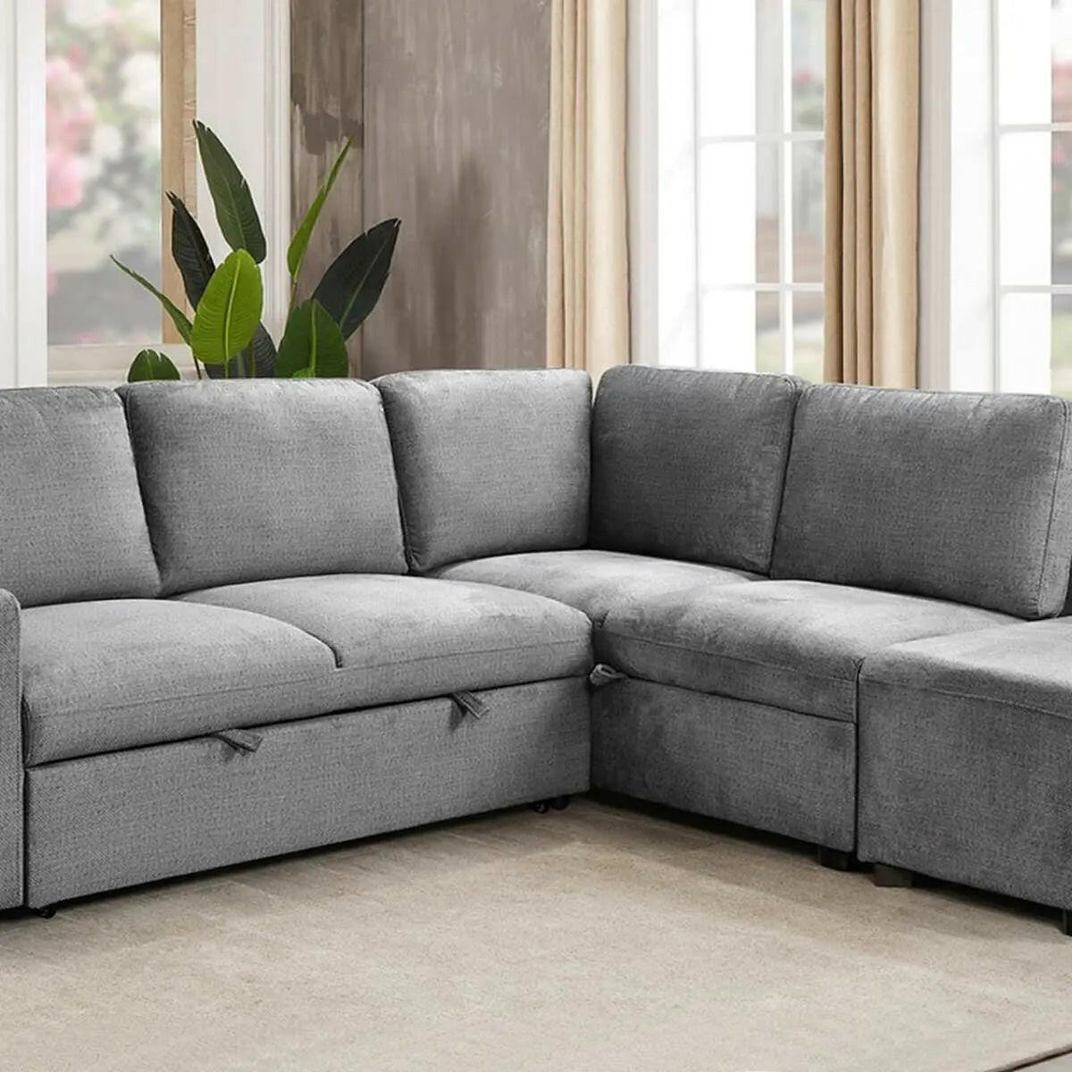 Grey Valencia sectional sleeper sofa with ottoman by IFF, showcasing its modern design and spacious sleeping area.