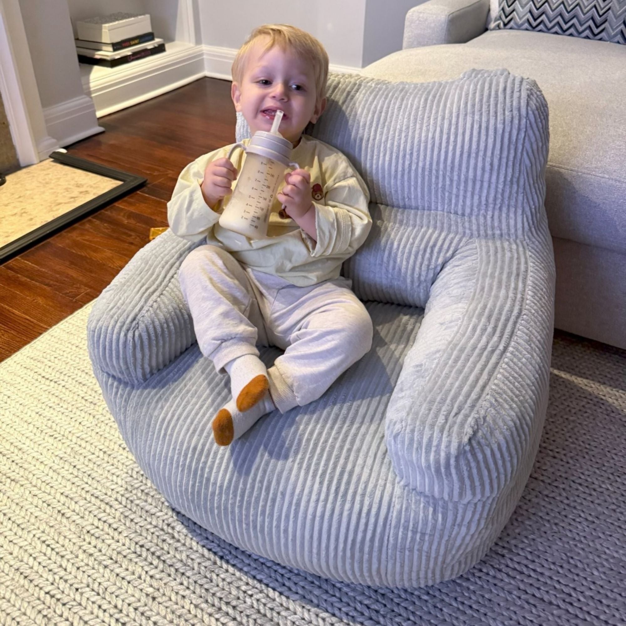 Grey Kai Foam Kids’ Chair by Brassex, a small accent chair with a comfortable foam seat and modern design, suitable for children.