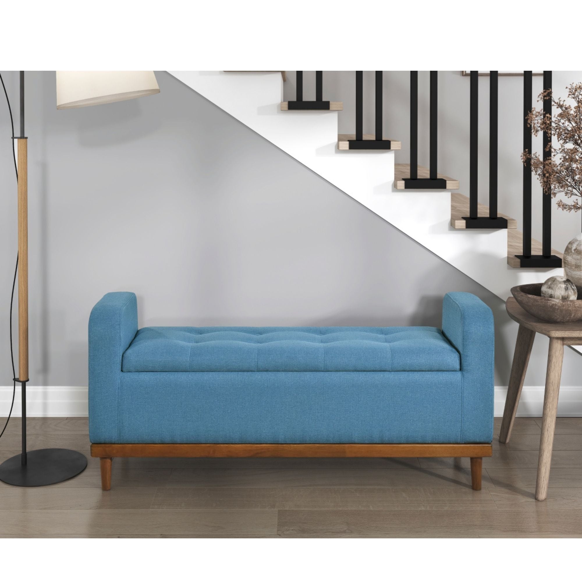 Blue fabric MAZ Brigitte Collection lift-top storage ottoman with interior space and sturdy design.