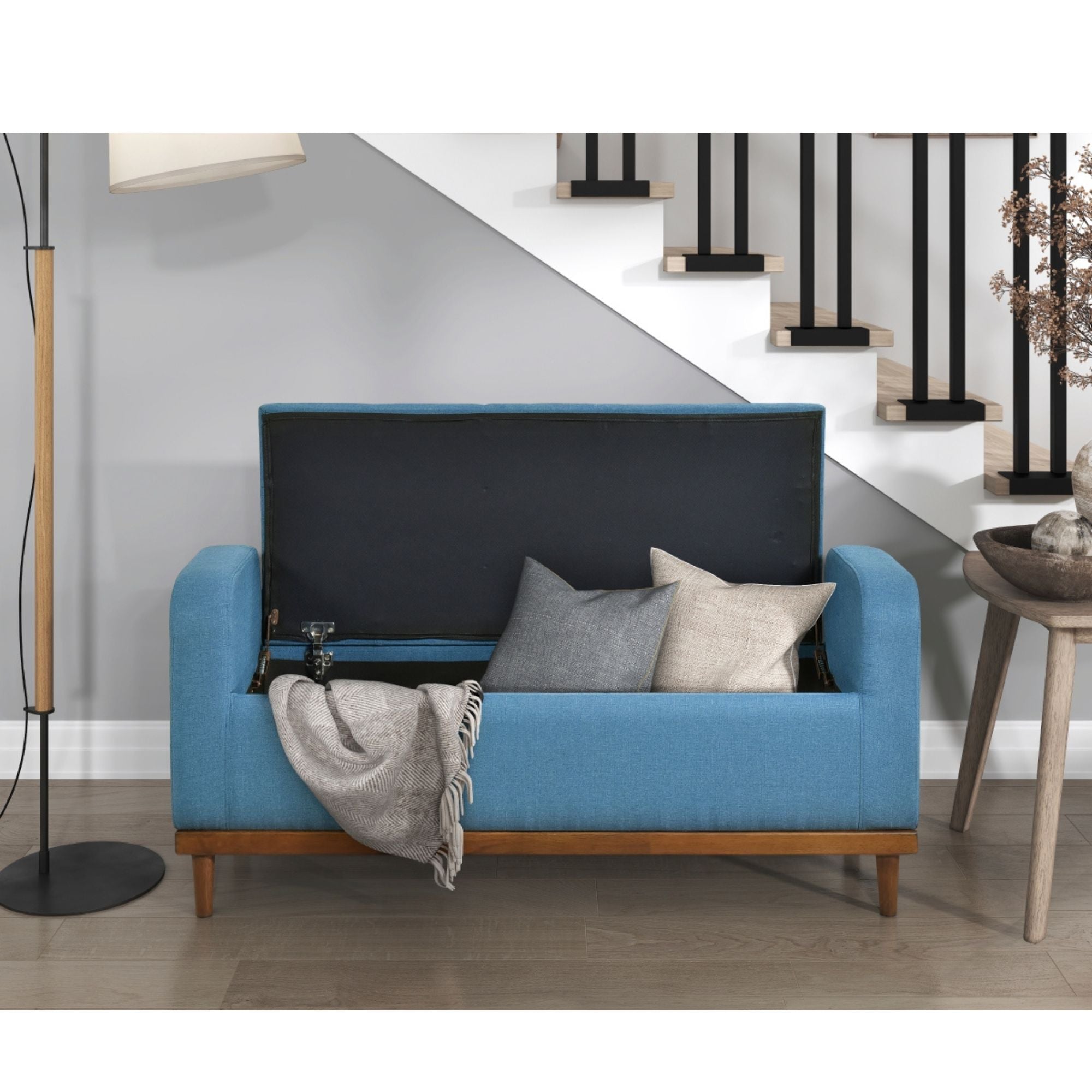 Blue fabric MAZ Brigitte Collection lift top storage ottoman with hidden storage and cushioned top for seating.