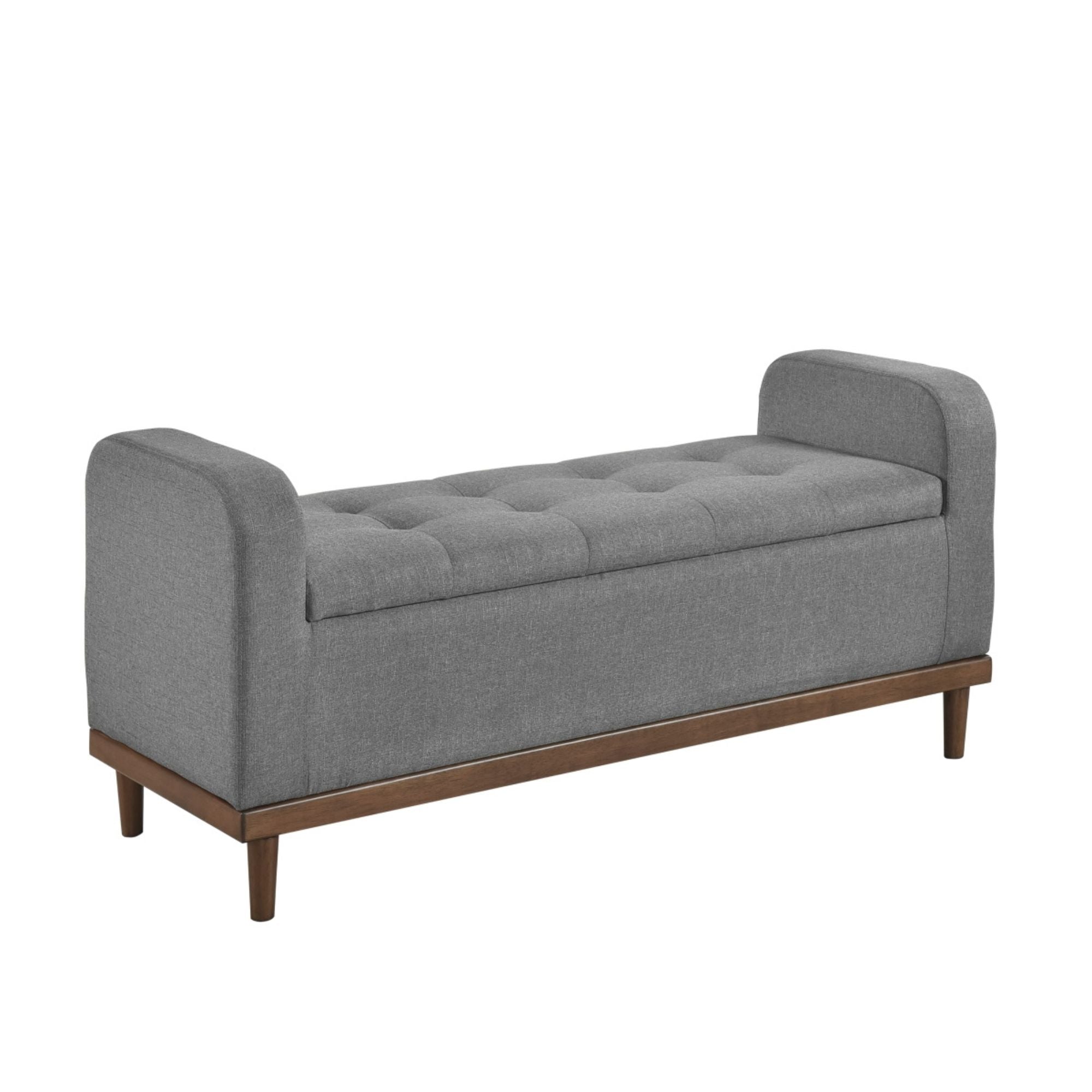 Grey fabric MAZ Brigitte Collection lift-top storage ottoman with cushioned top and spacious interior for versatile storage.