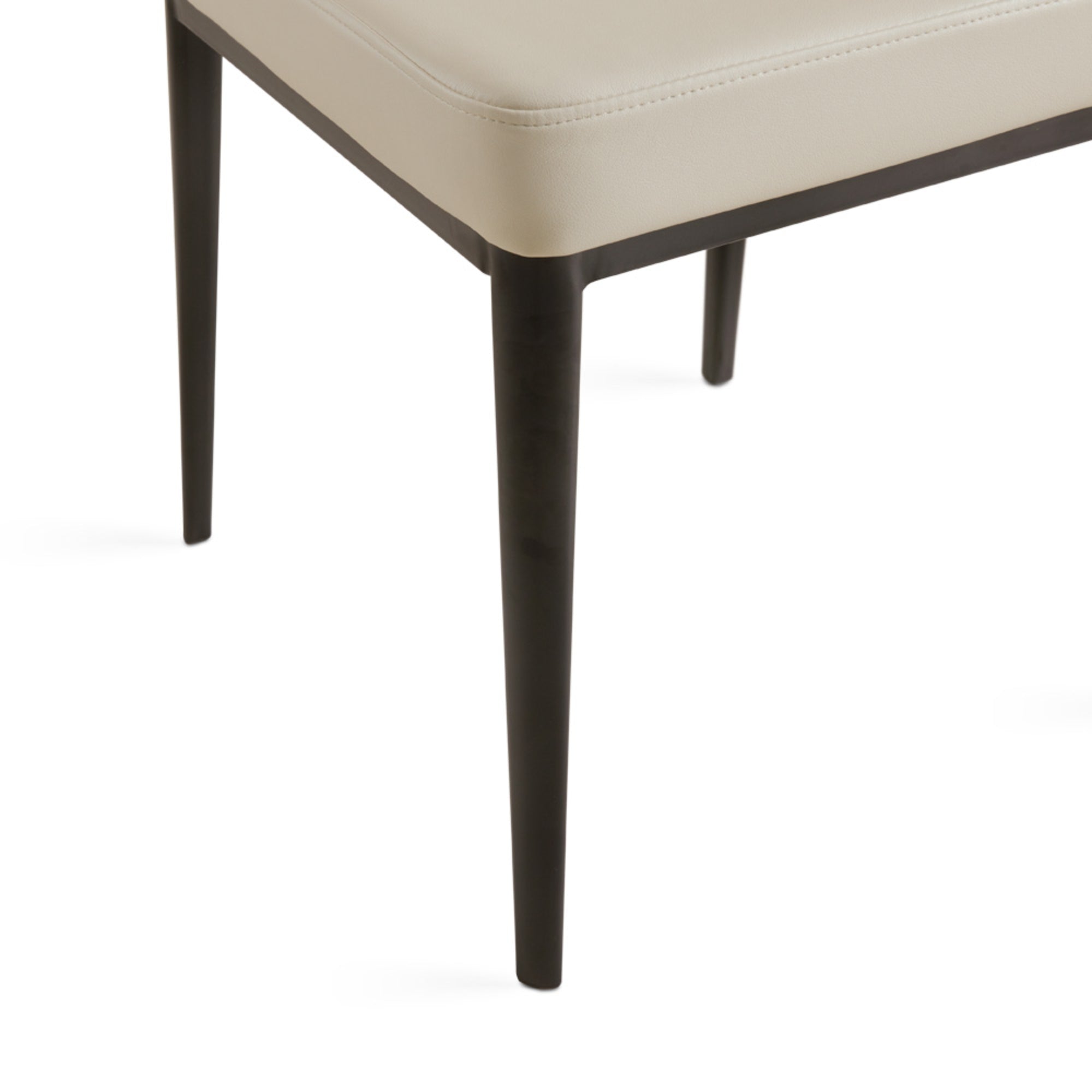 Set of two beige PU shell-shaped dining chairs by Xcella with curved backrests and modern design.