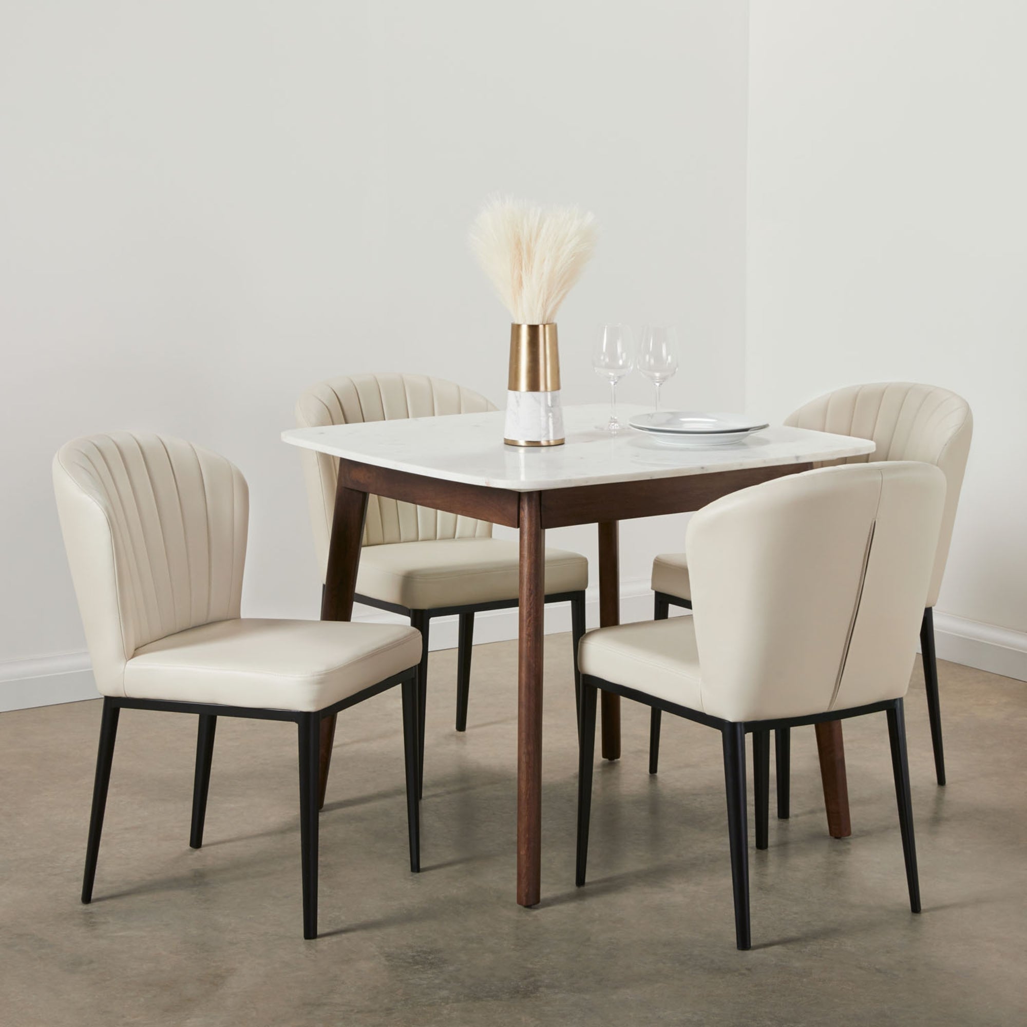 Set of two Xcella beige shell-shaped dining chairs with PU upholstery, modern and stylish seating for dining rooms.