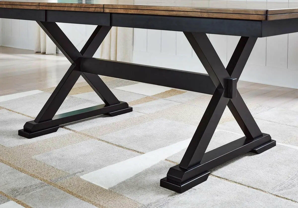 Wildenauer RECT dining room table by Signature Design Ashley with a wooden base and rectangular tabletop, set in a modern dining space.