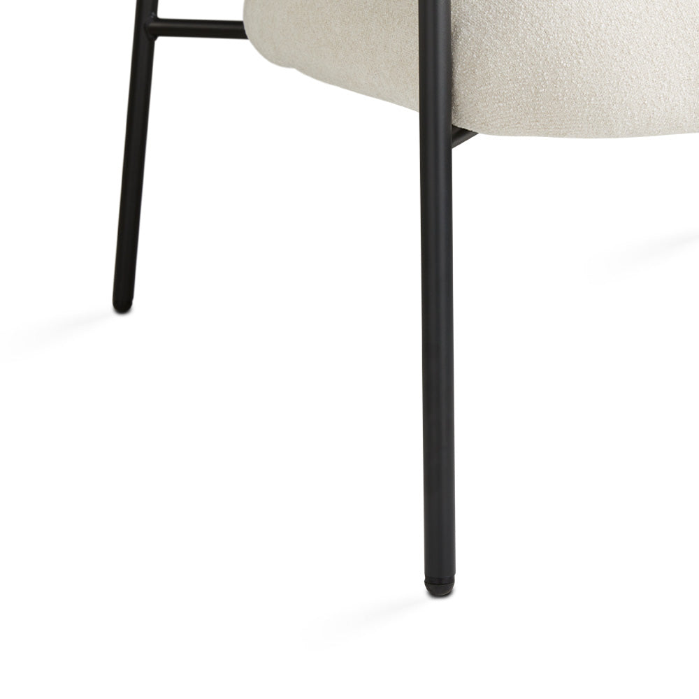 Beige Alvin accent chair by Xcella with wooden legs, featuring a plush cushioned seat and modern design for stylish living spaces.