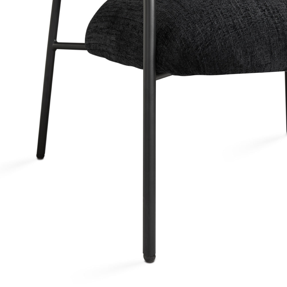 Black Xcella Alvin accent chair with sleek modern design and plush upholstery, perfect for stylish living room decor.