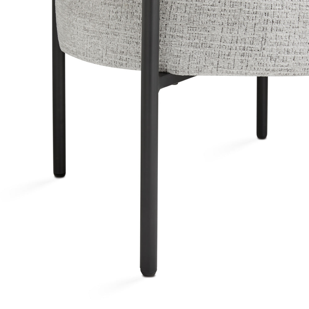 Xcella Mallory accent chair with ash wood base, featuring a modern design and cushioned seat for stylish comfort.
