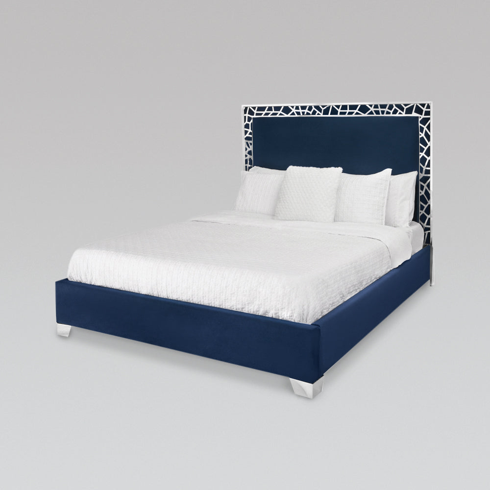Blue velvet Wellington Bed by Xcella with a modern upholstered frame and plush headboard for a stylish bedroom look.